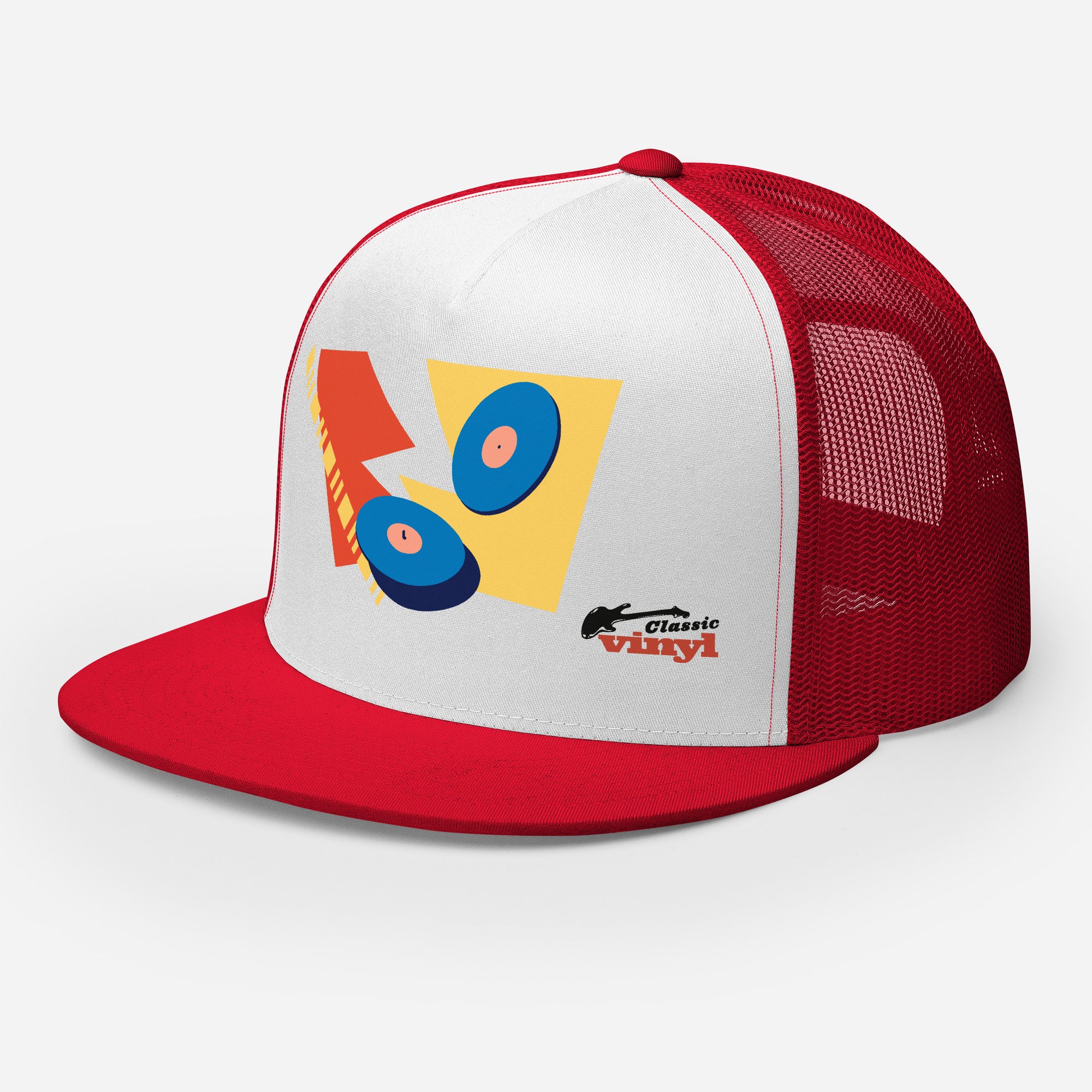 Left front angled view of a red and white trucker hat with a red brim and mesh back. The white front panel features a colorful abstract design with two blue vinyl records and red and yellow shapes, plus the 'Classic vinyl' logo printed in black and red on the lower right side.