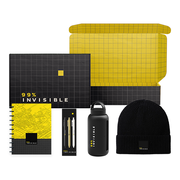 A collection of branded merchandise from ‘99% Invisible,’ including a yellow and black grid-patterned mailer box, spiral notebook, pen set, water bottle, and black knit beanie—all with matching white and yellow ‘99% Invisible’ branding.