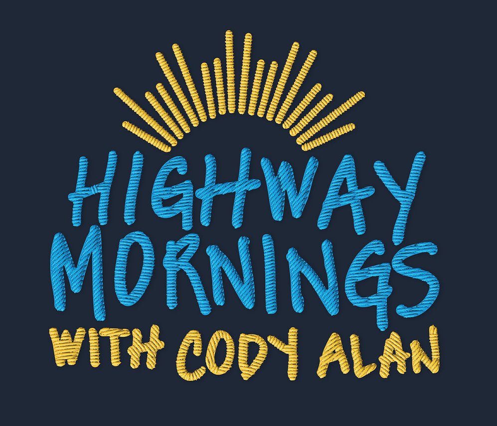 Close-up of a stylized embroidery design featuring a yellow sunburst above blue and yellow stitched text that reads 'HIGHWAY MORNINGS WITH CODY ALAN' on a navy background.