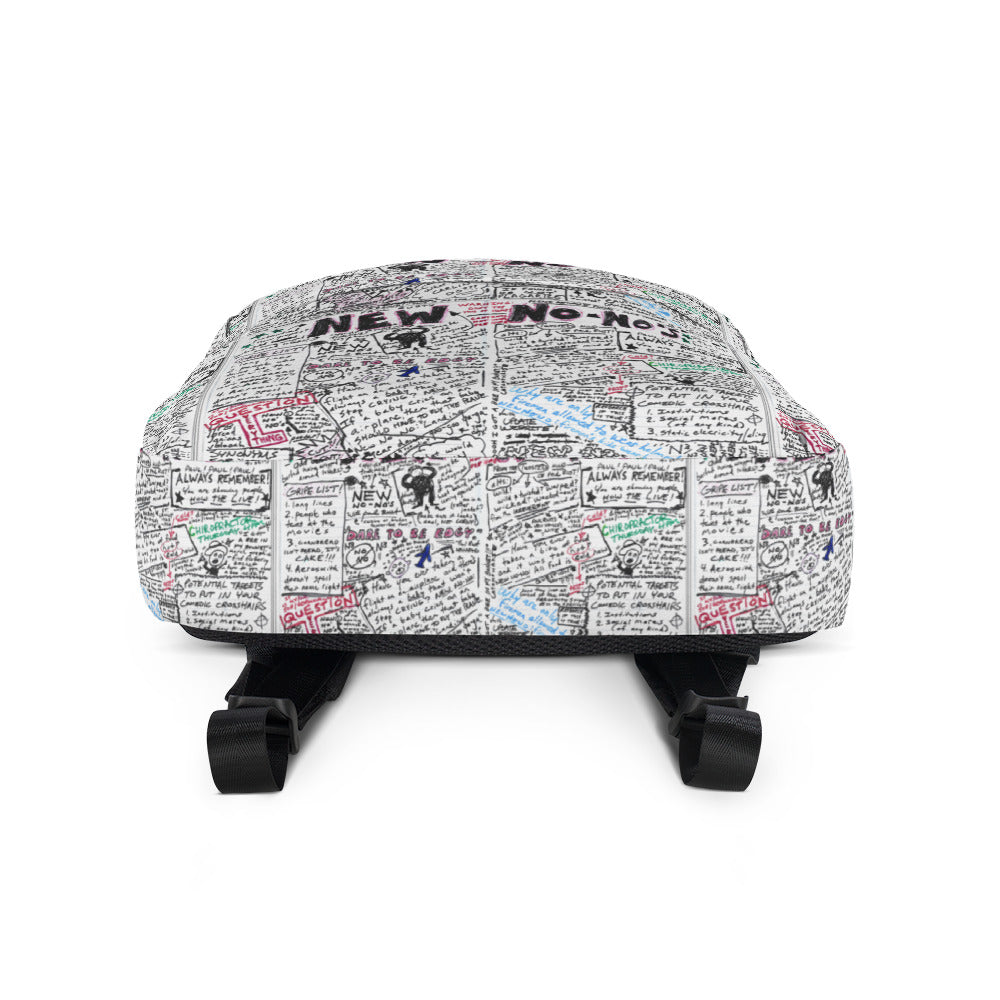 Bottom side of a backpack featuring a collage of handwritten notes, doodles, and colorful text.