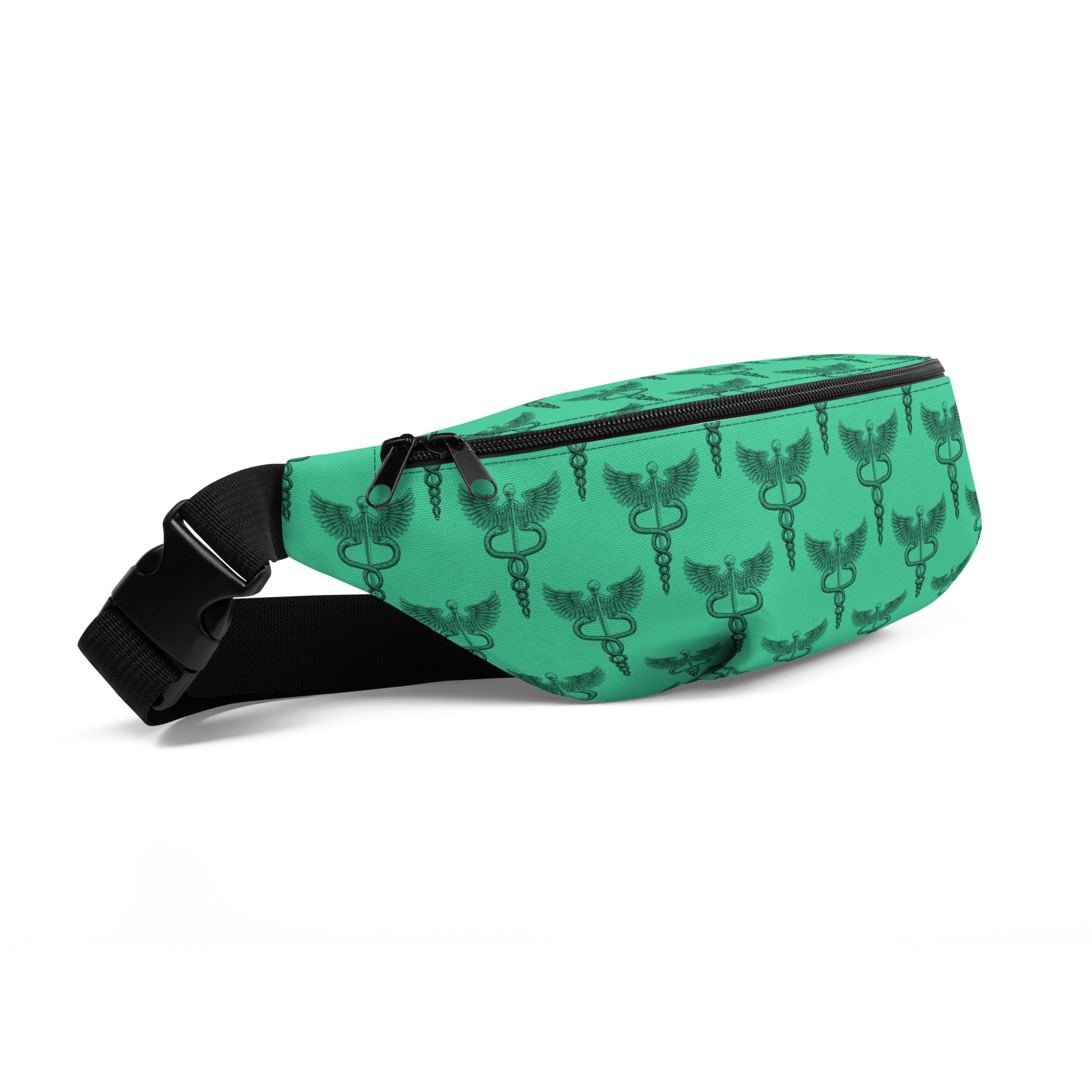 A green fanny pack is shown from a front-left angle with a repeating black print of the caduceus symbol — a staff with two intertwined snakes and a pair of wings at the top, representing medicine and healing. The bag has a black zipper, an adjustable black strap, and a plastic buckle.