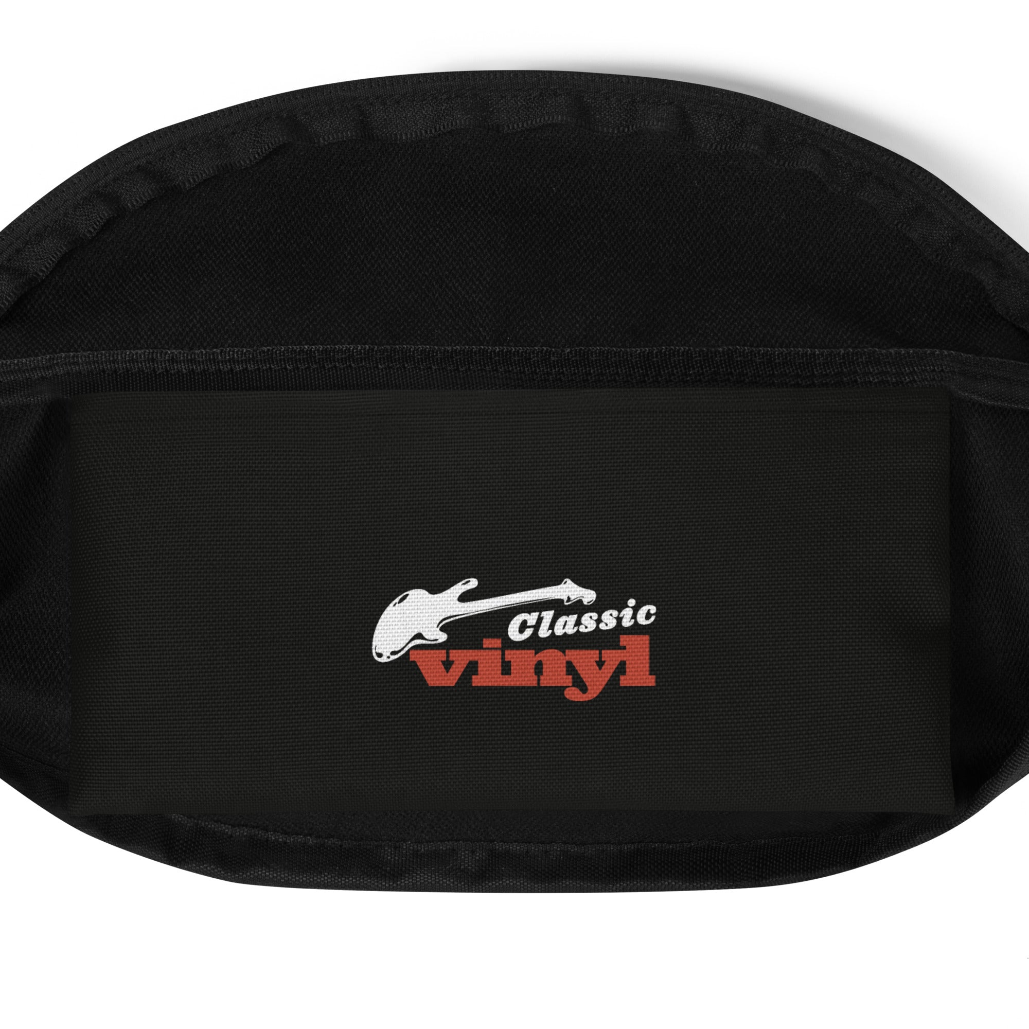 Inside view of the fanny pack showing a black lining with the 'Classic vinyl' logo printed in white and red, featuring a white guitar silhouette above the text.