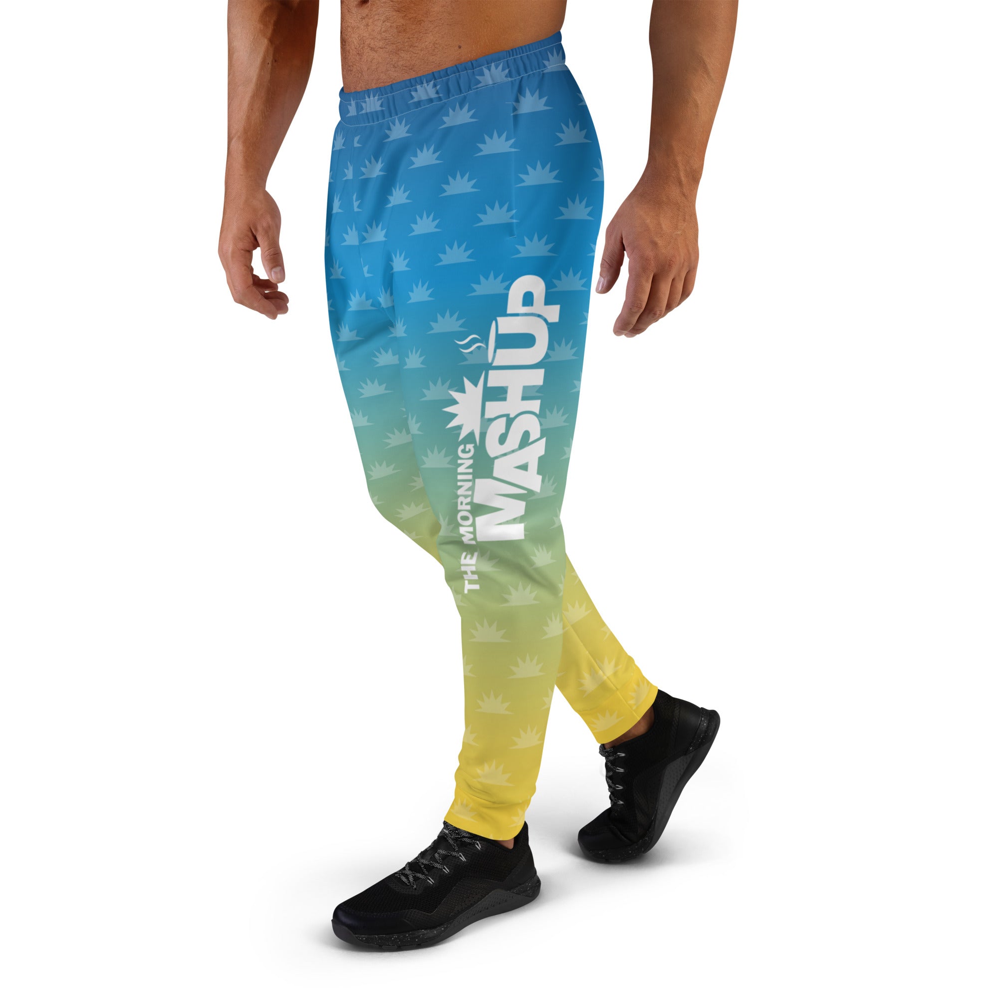 Gradient blue and pink joggers with a crown pattern and the logo 'THE MORNING MASHUP' printed on the side.