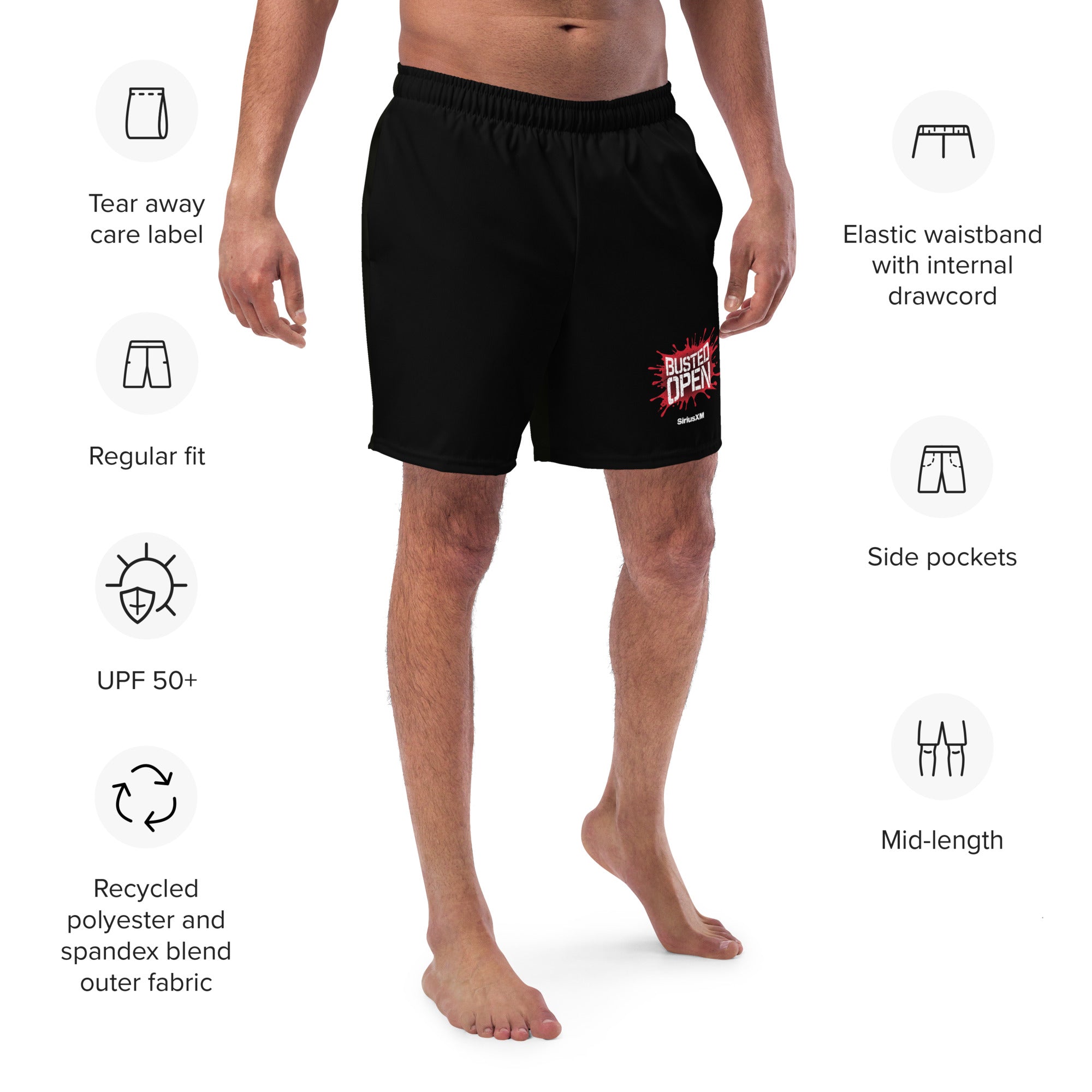 A model is wearing the shorts, displaying a printed “BUSTED OPEN” graphic with the SiriusXM logo on the front left leg.surrounded by icons indicating features such as 'UPF 50+', 'Side pockets', 'Recycled fabric', and 'Elastic waistband with drawcord'.