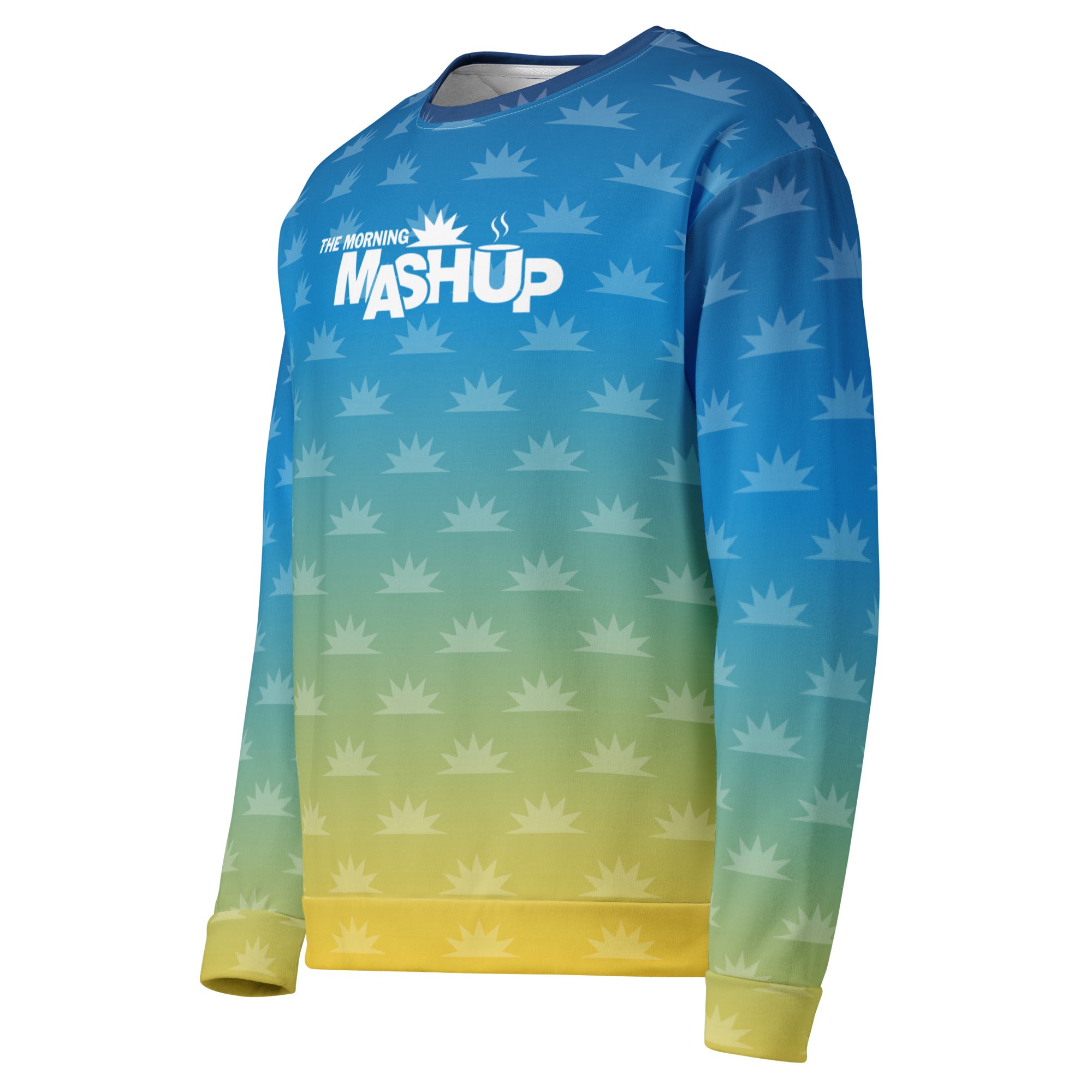 A colorful long-sleeve sweatshirt featuring an ombre design from blue to yellow, with a pattern of small yellow sunburst shapes and the text 'THE MORNING MASHUP' prominently displayed in white.