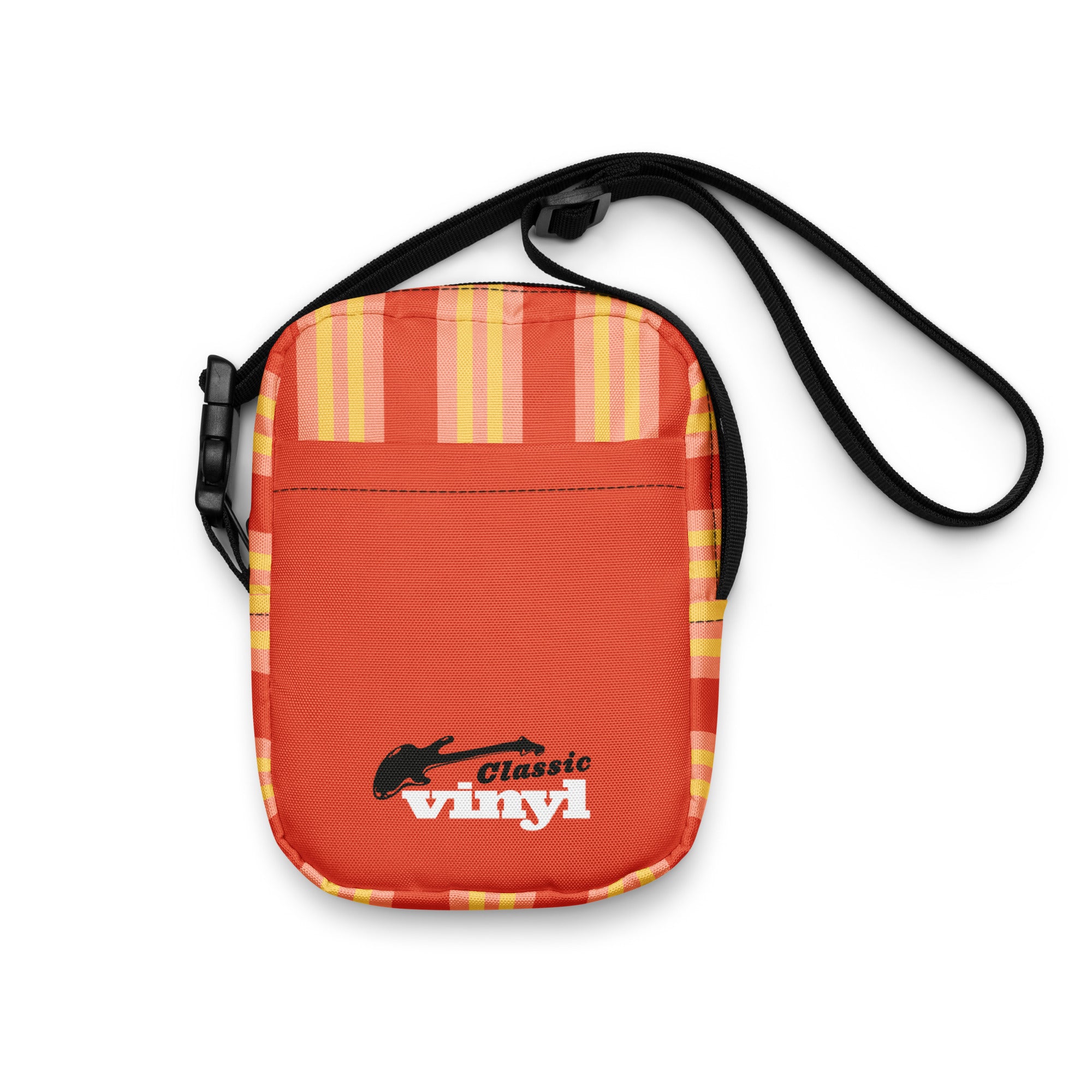 Front view of a small orange crossbody bag with yellow and light pink vertical stripes along the top edge. The front pocket displays the 'Classic vinyl' logo with a black guitar silhouette and white and red text.