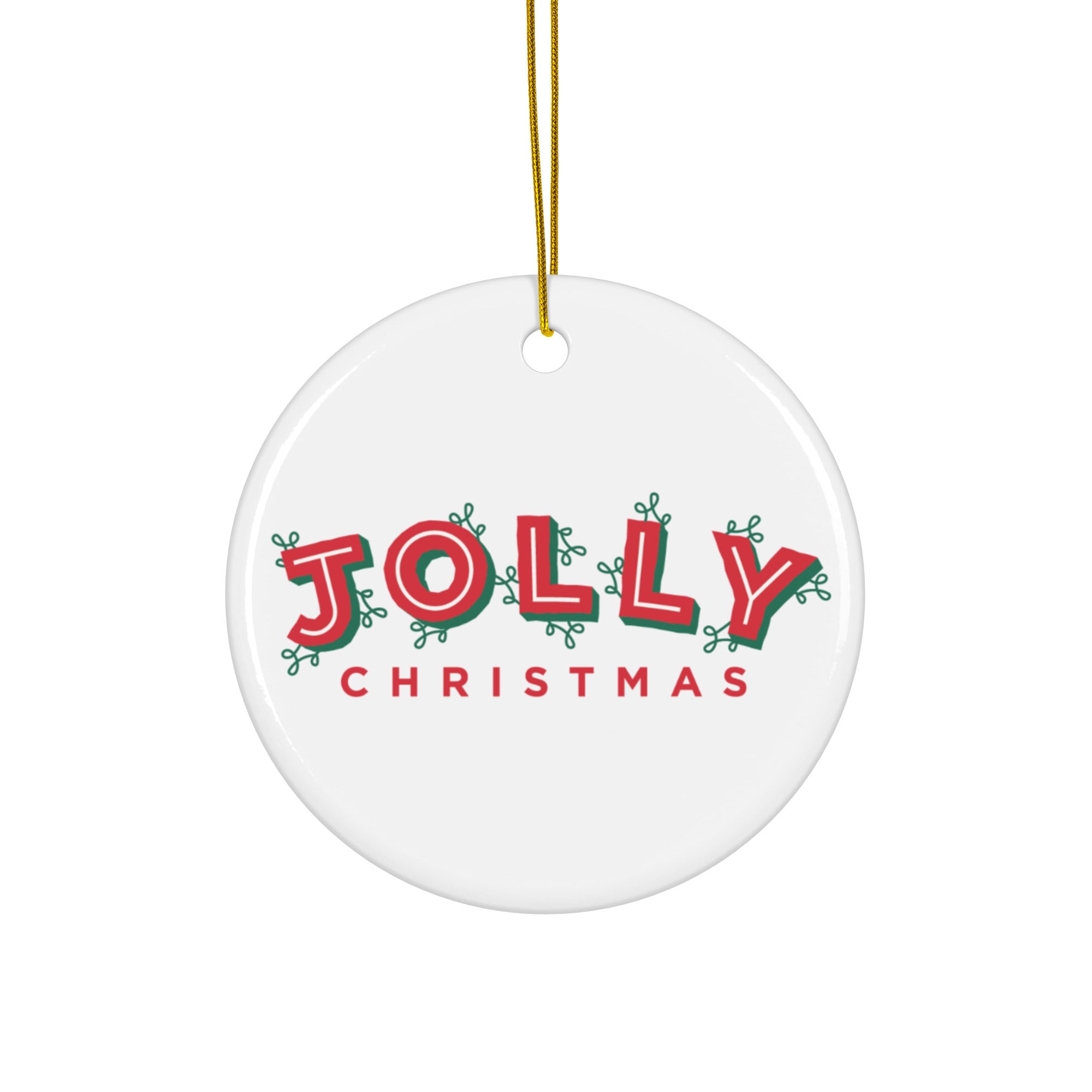 White round ceramic ornament with a gold hanging string, printed with the words ‘JOLLY CHRISTMAS’. The word ‘JOLLY’ is in bold red letters outlined in green with decorative loops, and ‘CHRISTMAS’ appears below in solid red.