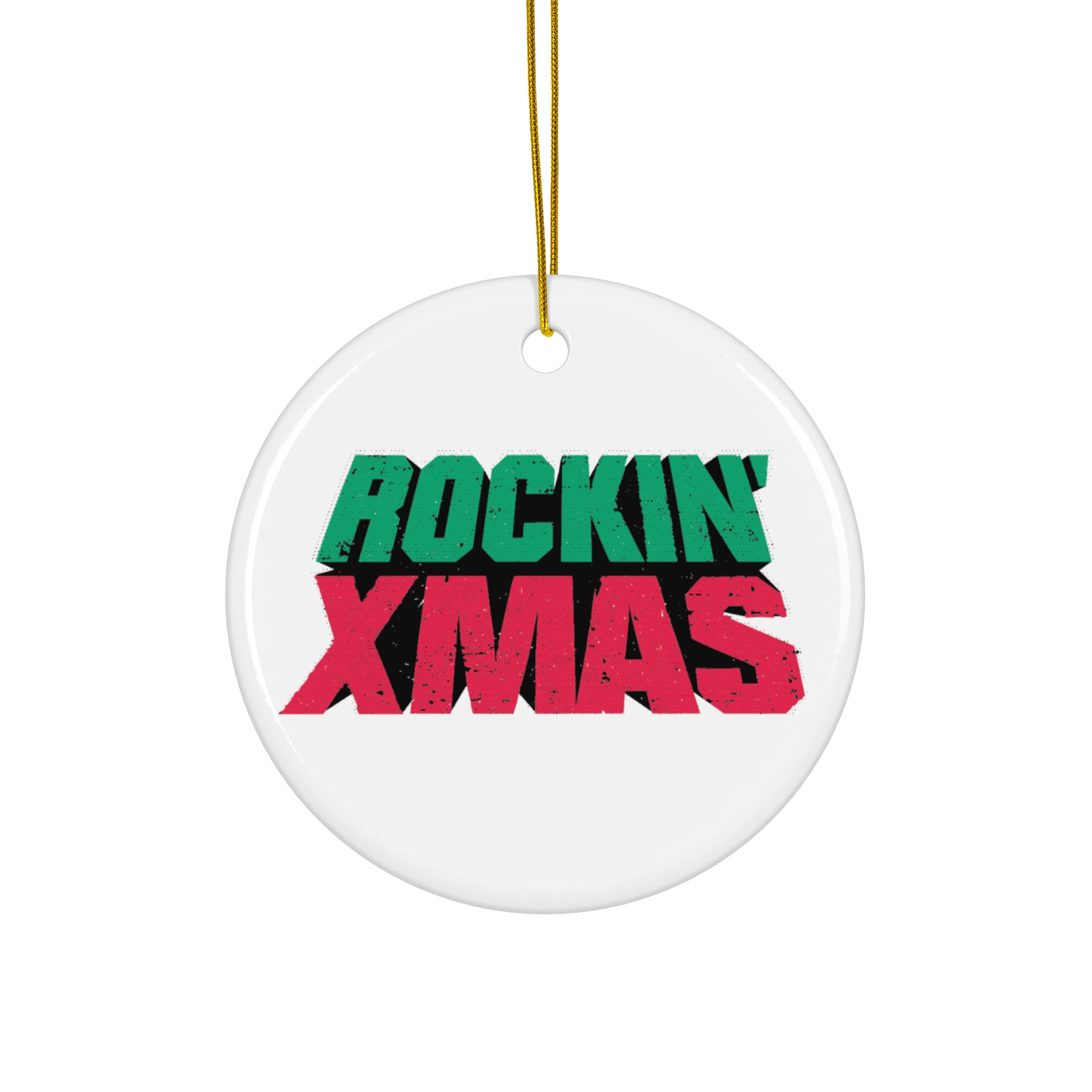 White round ceramic ornament with a gold hanging string, featuring the words ‘ROCKIN’ XMAS’ in bold distressed green and red letters centered on the front.