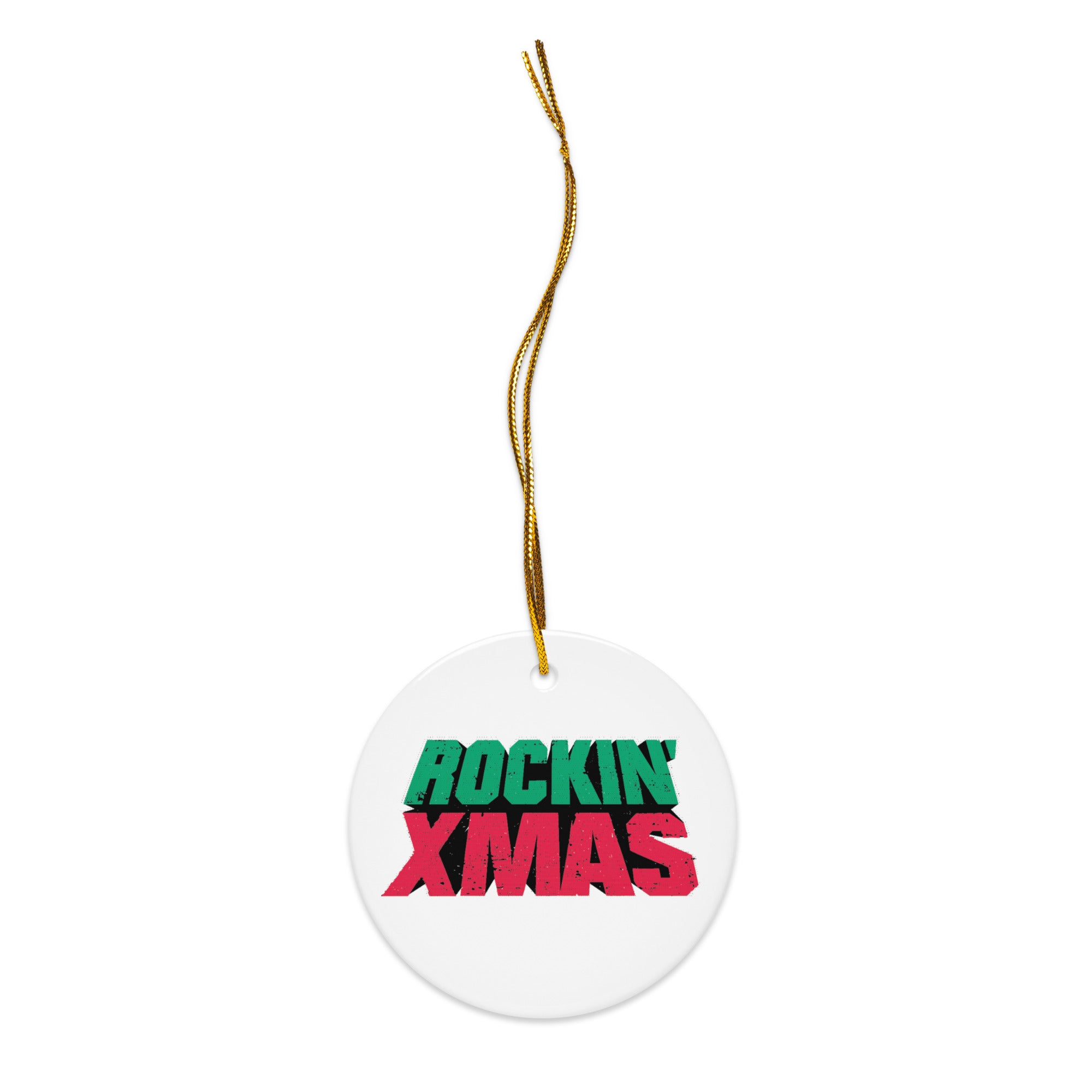White round ceramic ornament with a gold hanging string threaded through a small hole at the top, featuring the words ‘ROCKIN’ XMAS’ in green and red distressed lettering.