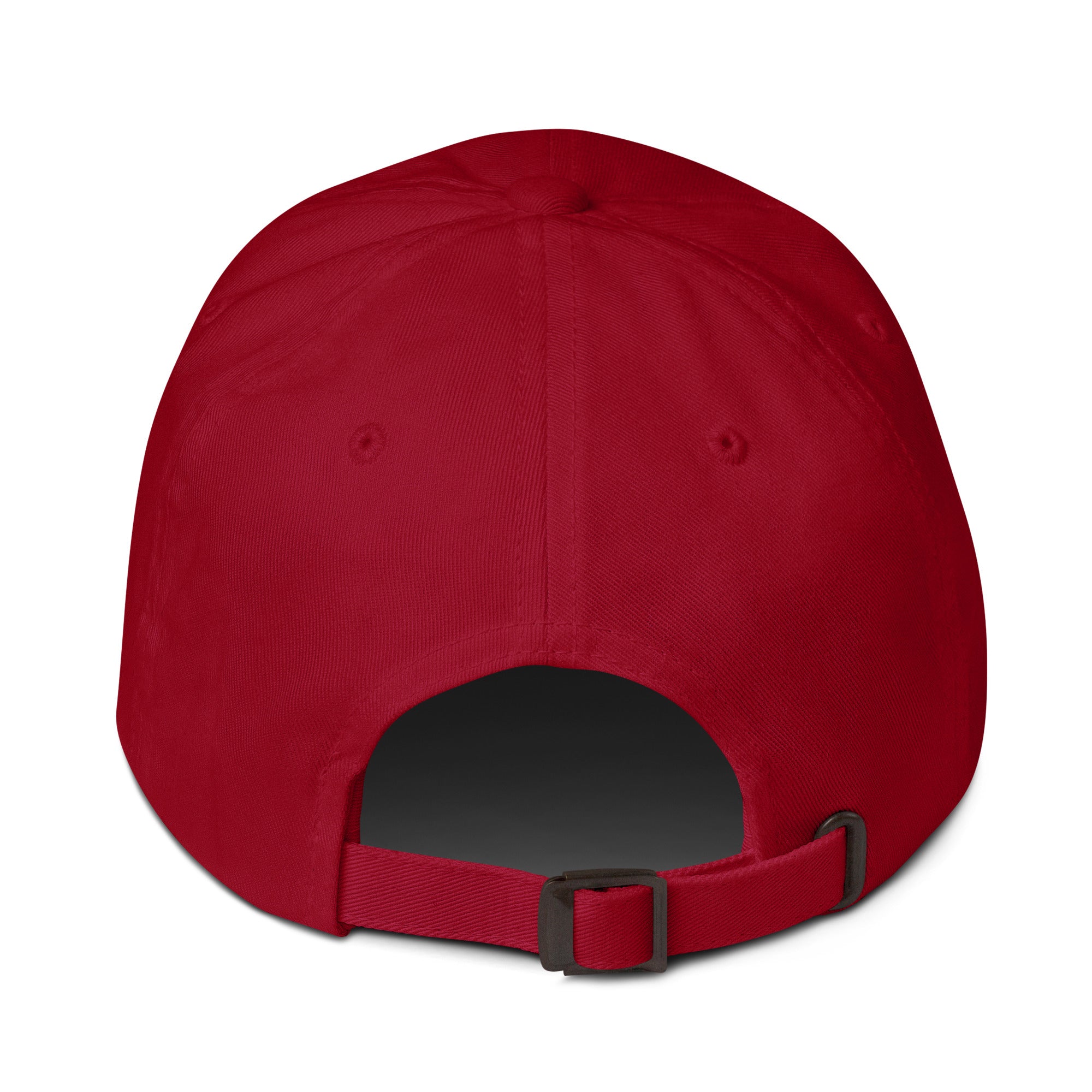 Back view of the red hat showing an adjustable strap with a metal clasp and a small opening above it.