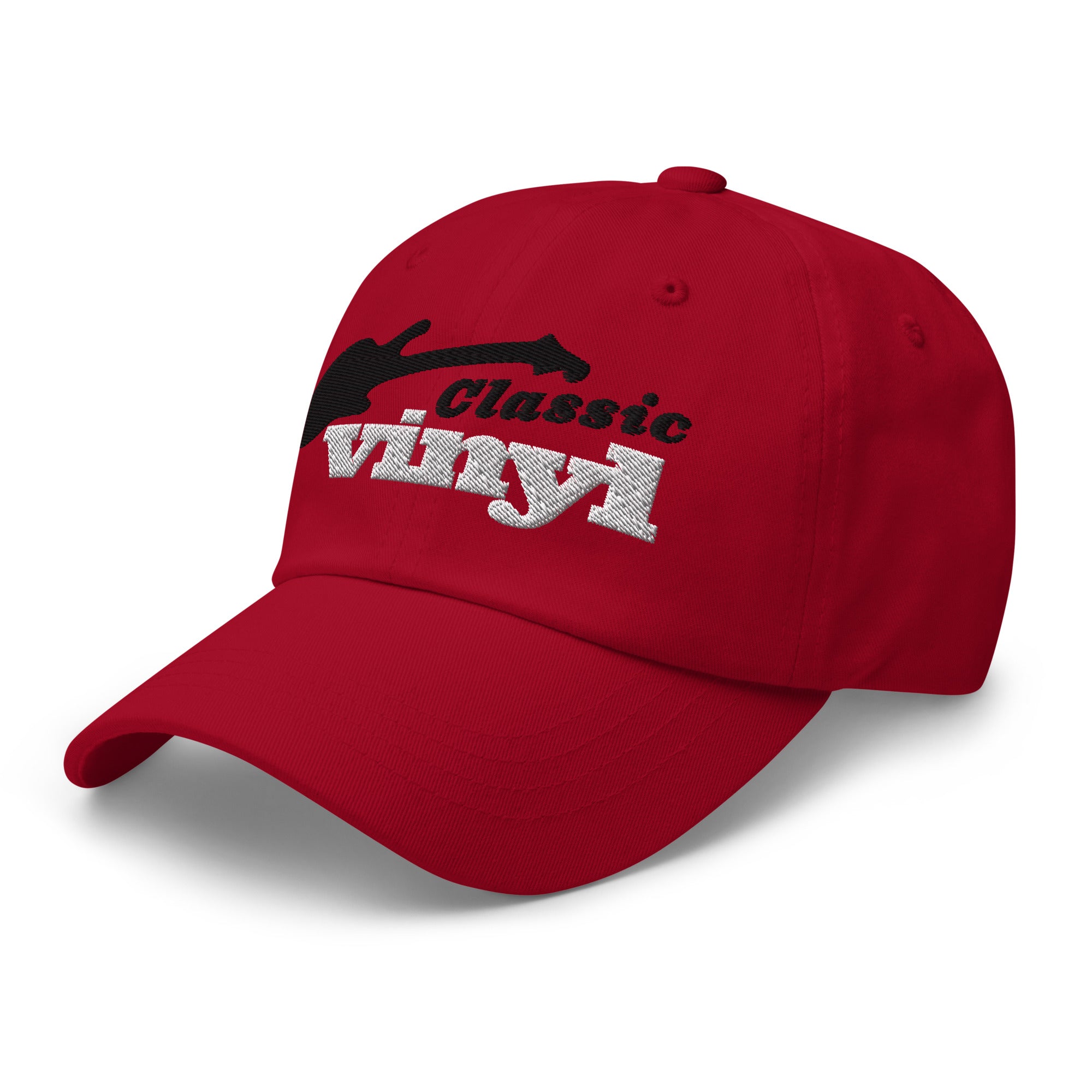 Angled front-left view of a red baseball-style hat with the 'Classic Vinyl' logo embroidered on the front. The logo features a black guitar silhouette above white text.