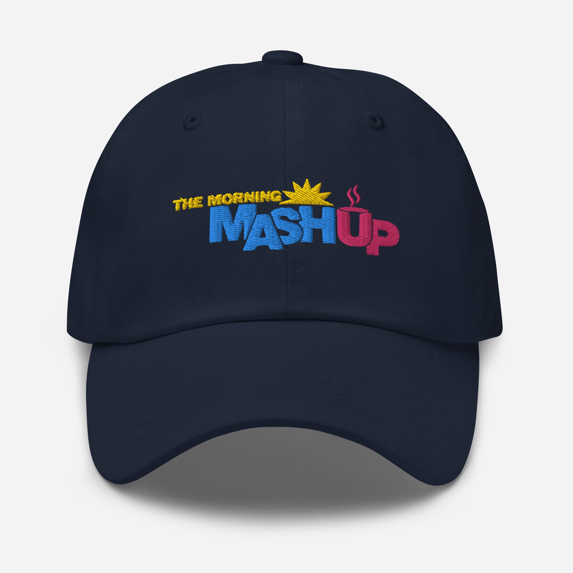 A navy blue baseball cap featuring the embroidered text 'THE MORNING MASHUP' with a sun and steaming coffee graphic.
