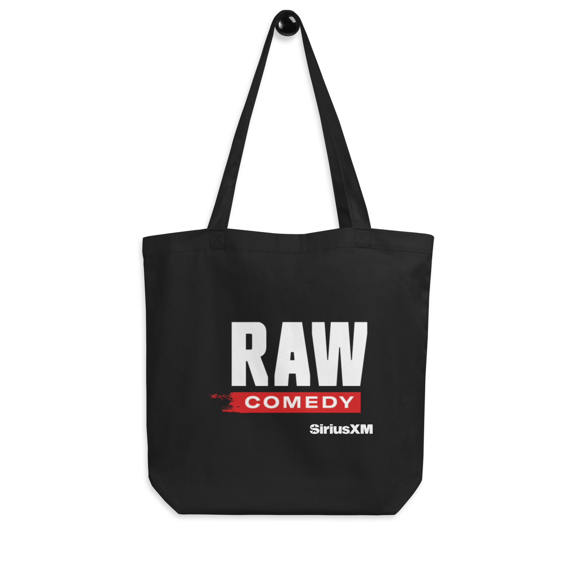 Black tote bag with 'RAW COMEDY' in bold white and red text, and 'SiriusXM' logo, on black background.