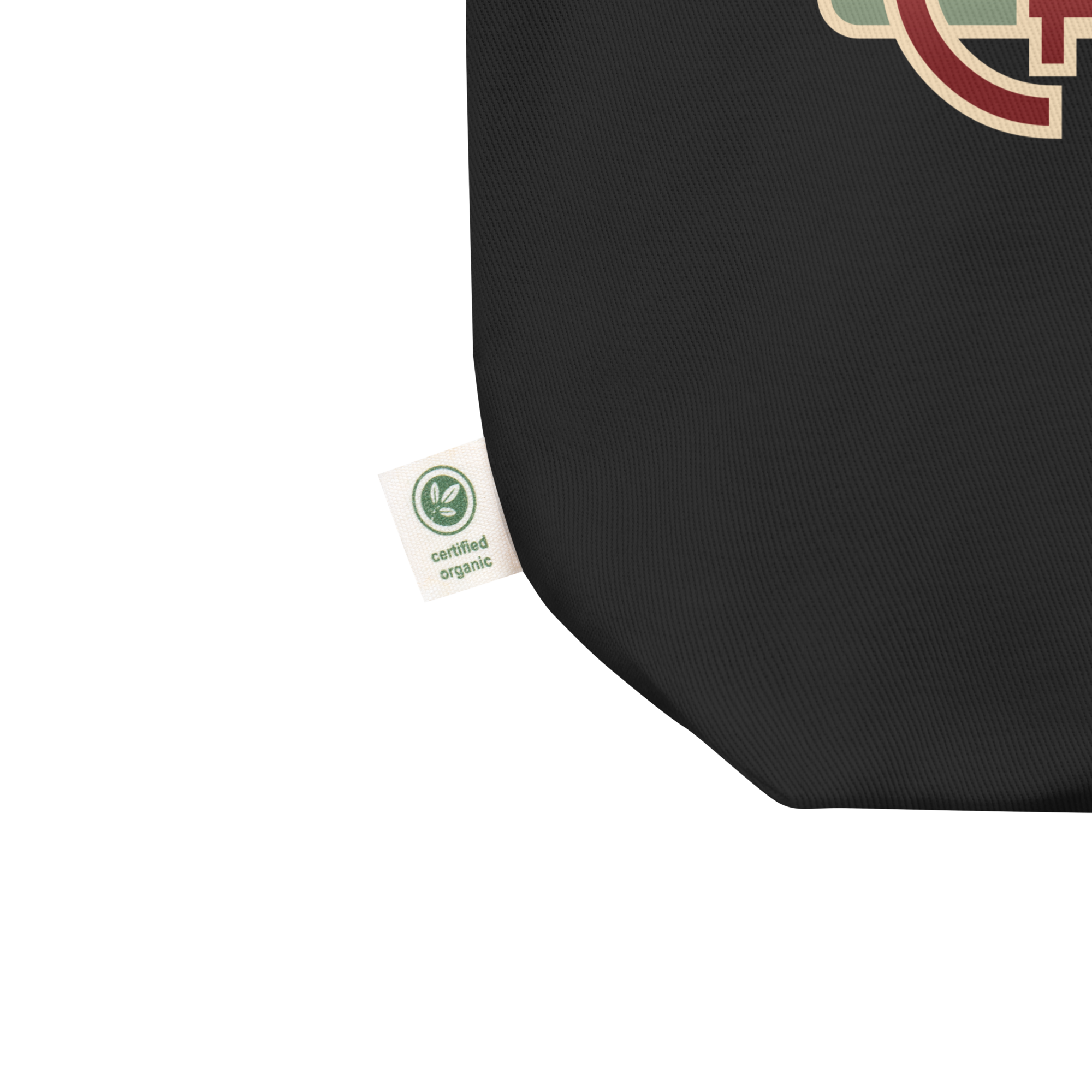 Black tote bag, close up of corner and a tag that reads 'certified organic.'