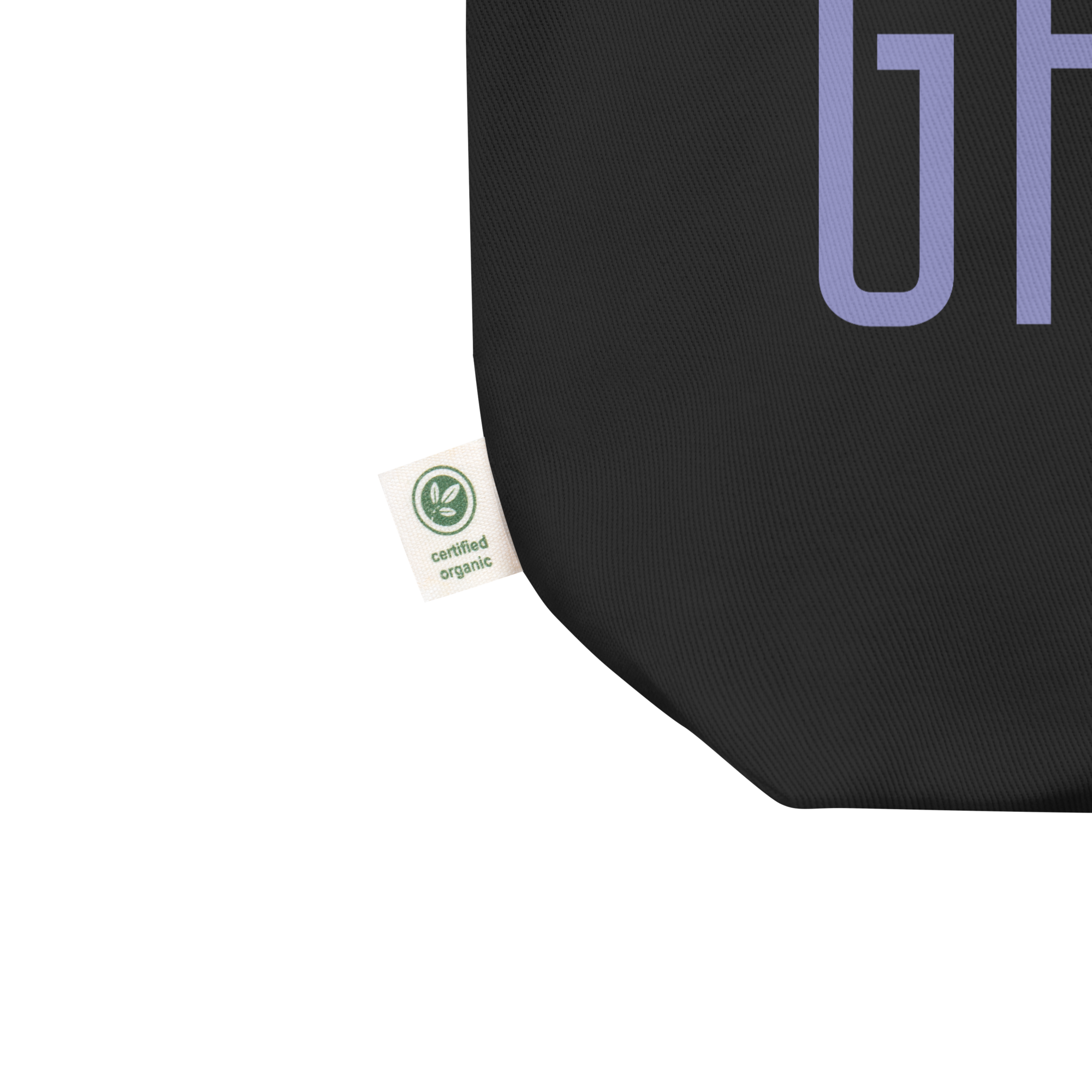 Corner of black tote bag with a small tag reading 'certified organic.'