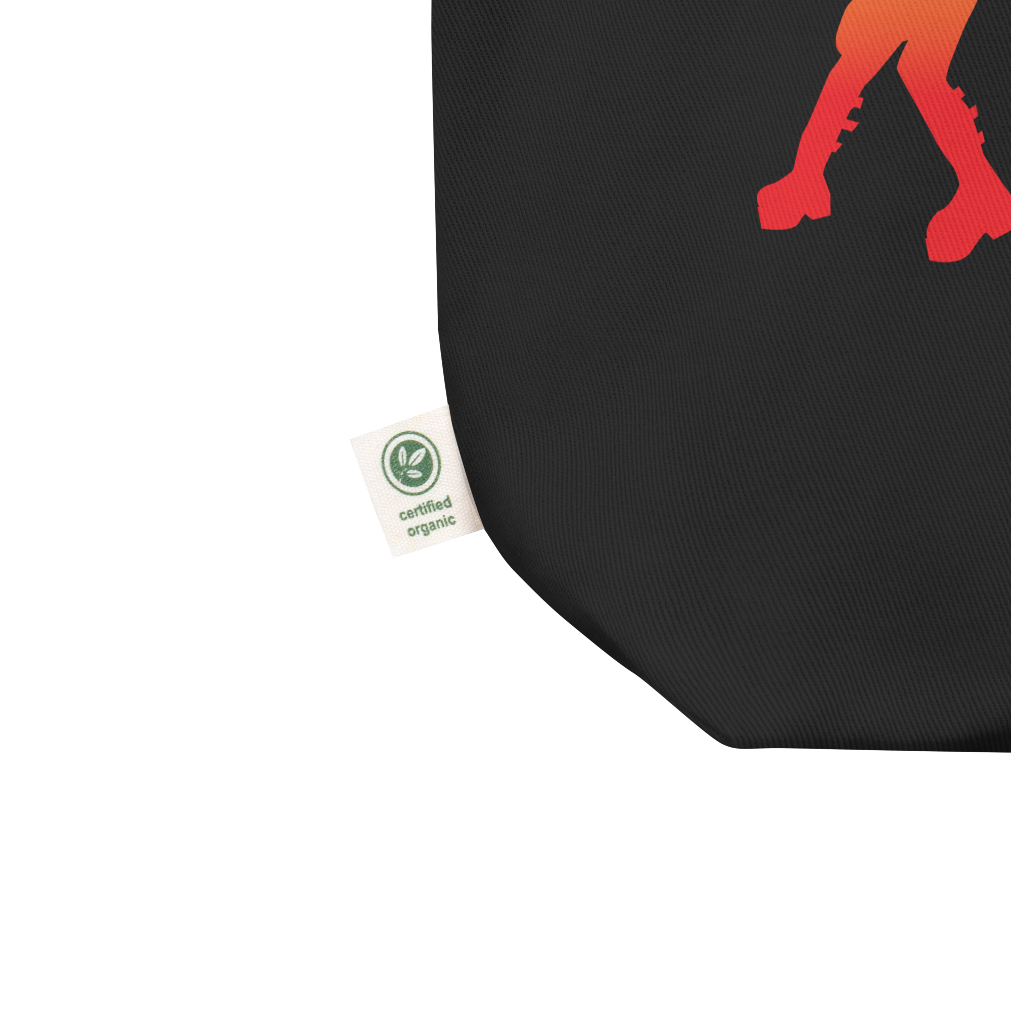 Close up of black tote corner featuring a 'certified organic' tag.