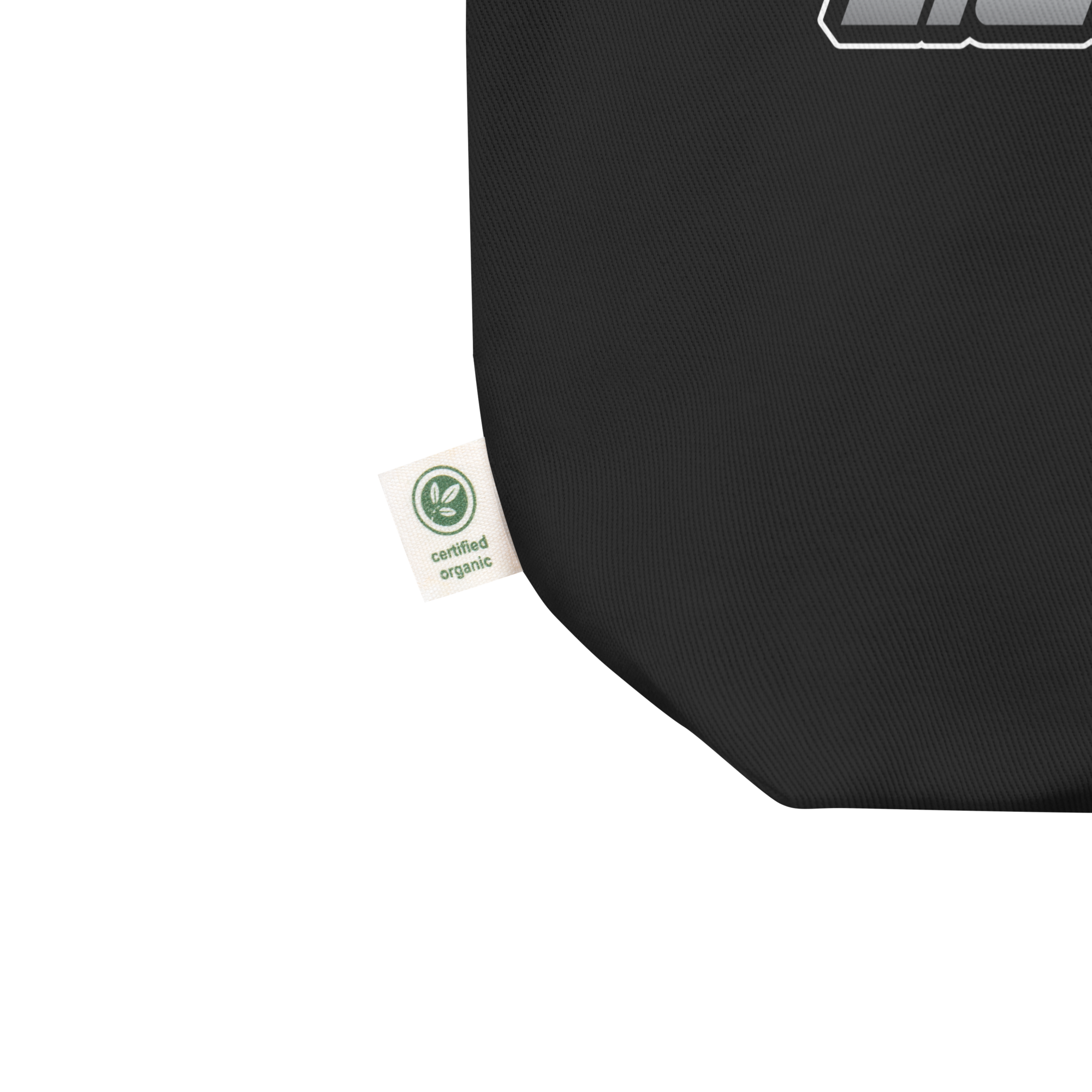 Close up of black fabric totate bag featuring a 'certified organic' tag.