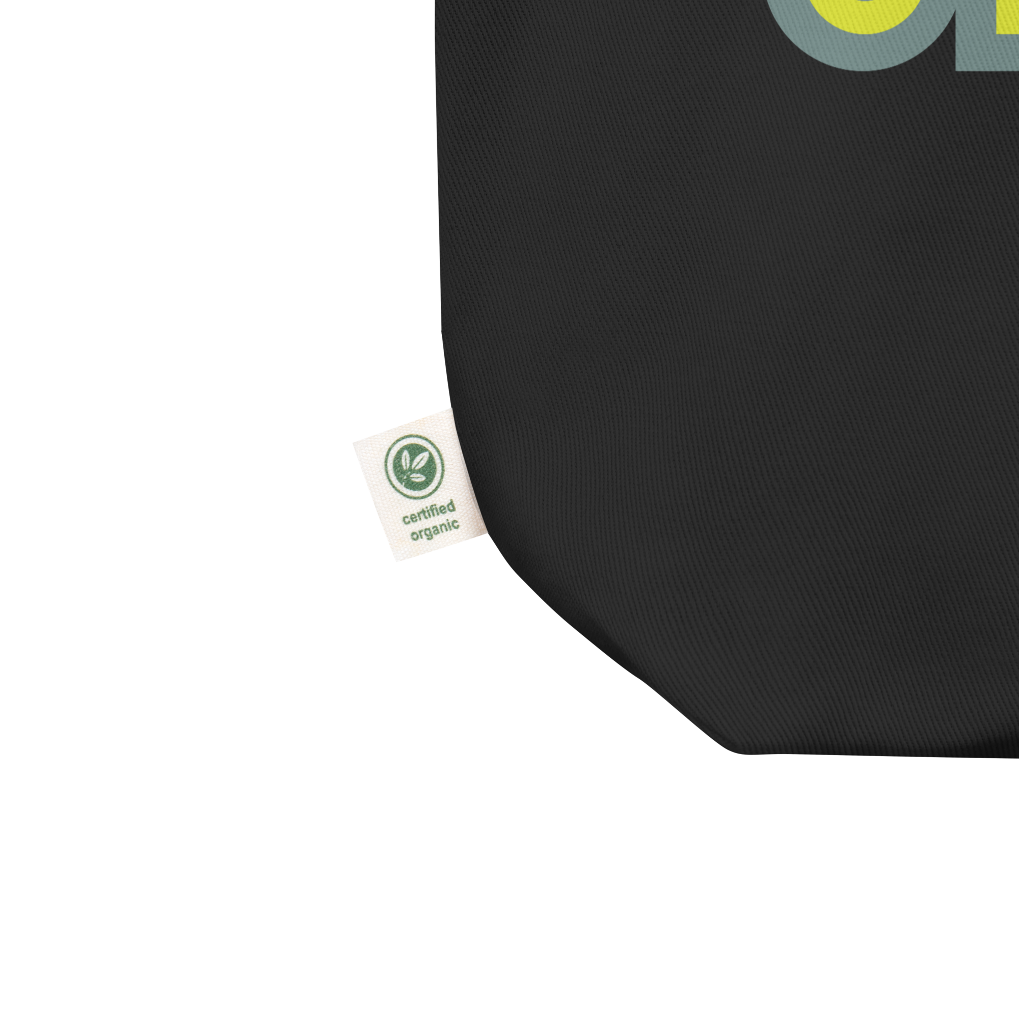 Close up of black tote corned with green certified organic tag on the side.
