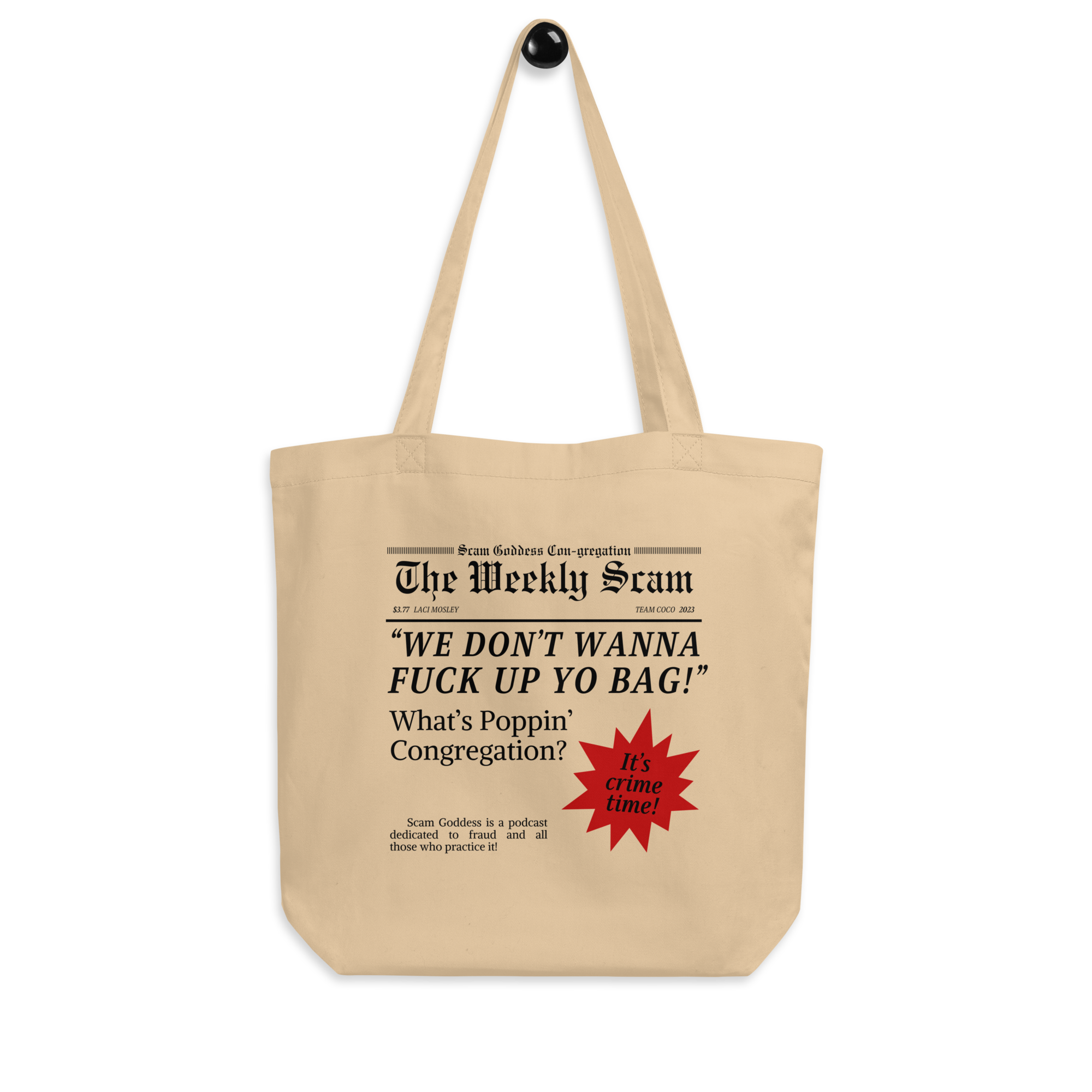 Cream colored tote bag with newspaper-style design featuring the phrase 'WE DON'T WANNA FUCK UP YO BAG!' and 'Scam Goddess' text featuring red sunburst graphic. Bag is on black background.