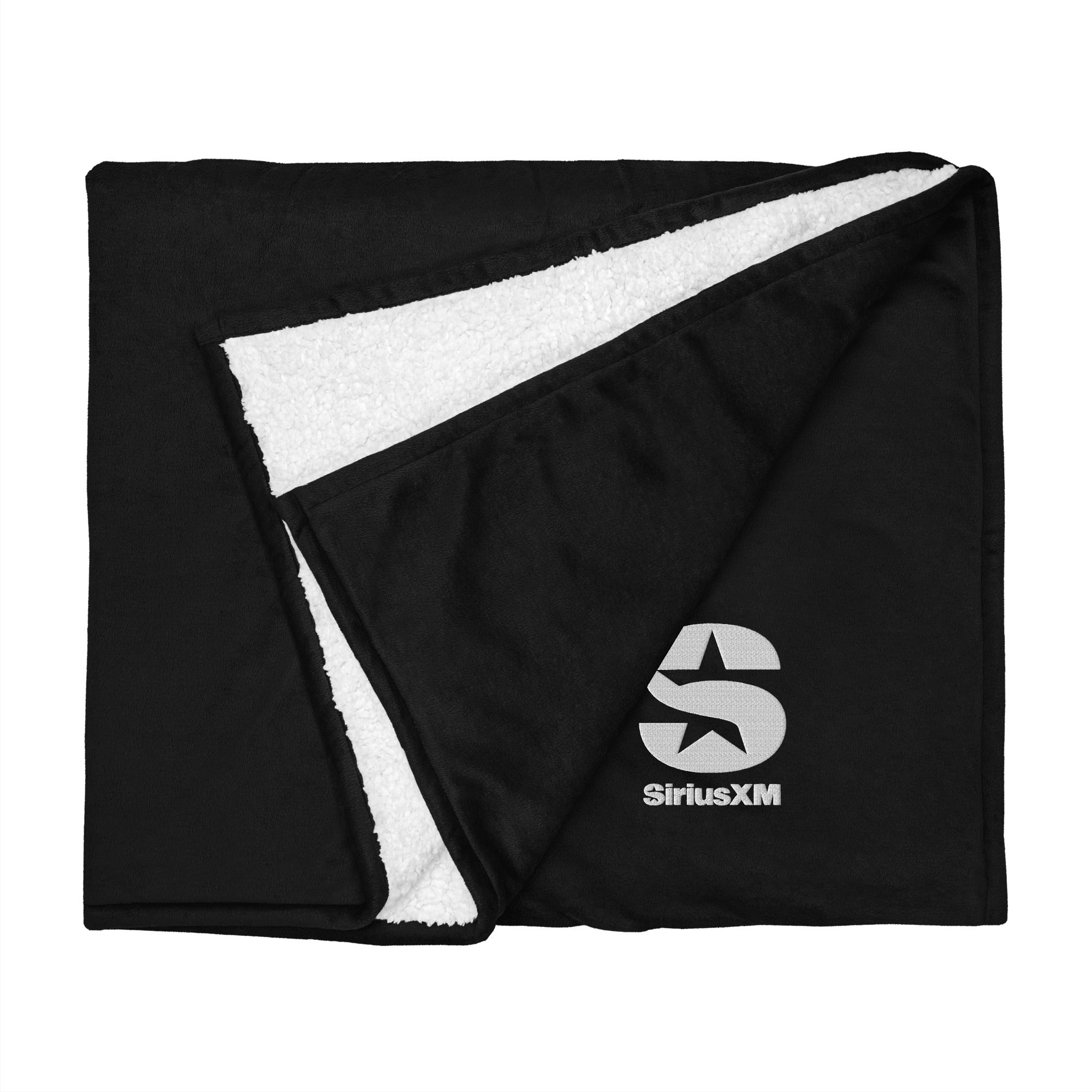 Black and white fleece blanket featuring the 'SiriusXM' logo at corner.