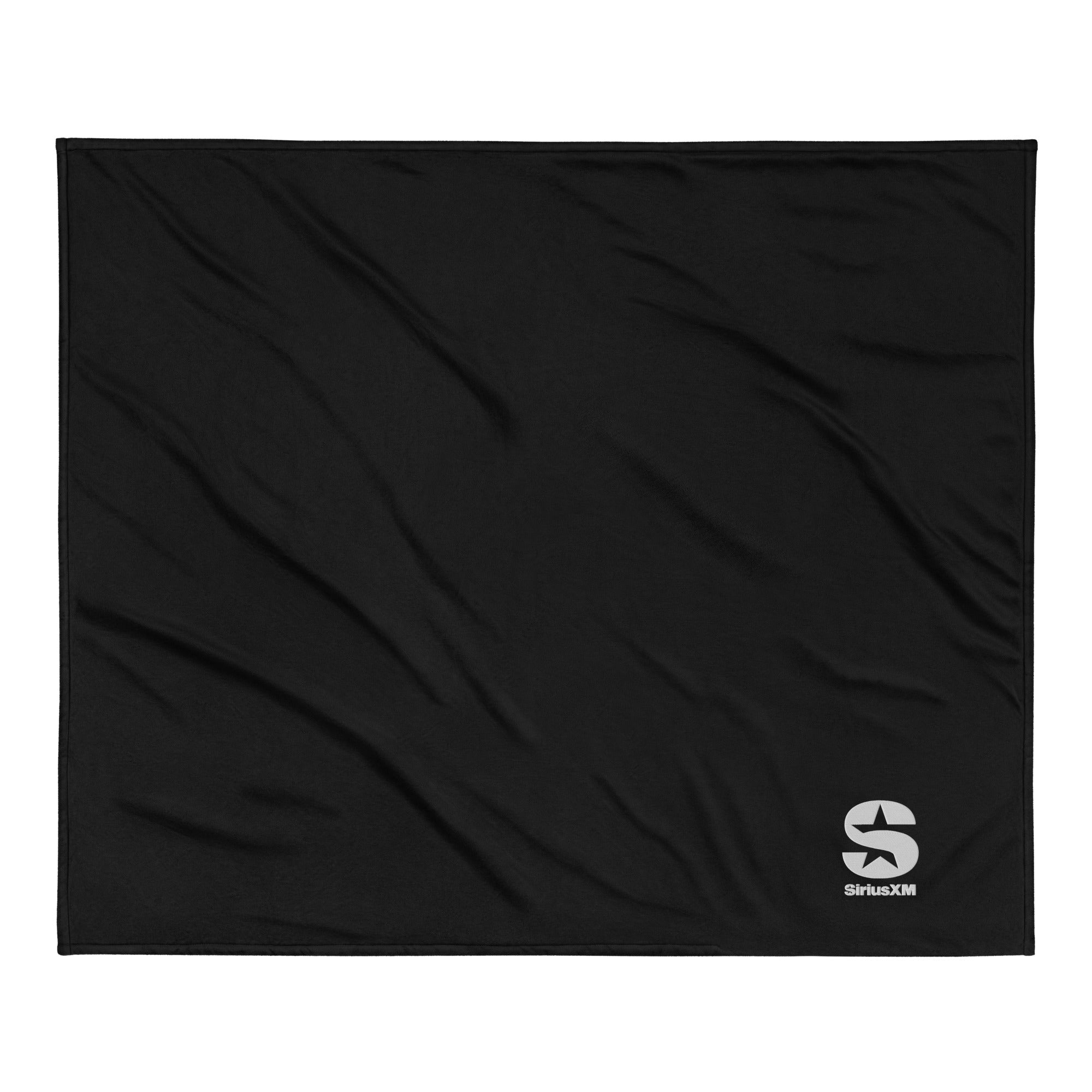 Black blanket featuring a silver 'SiriusXM' logo embroidred on the bottom right corner.