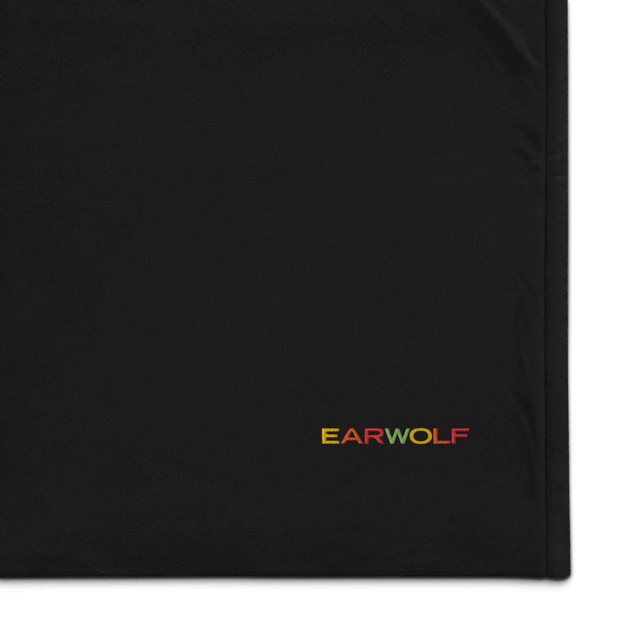 Black fabric featuring the embroidered logo 'EARWOLF' in colorful letters.