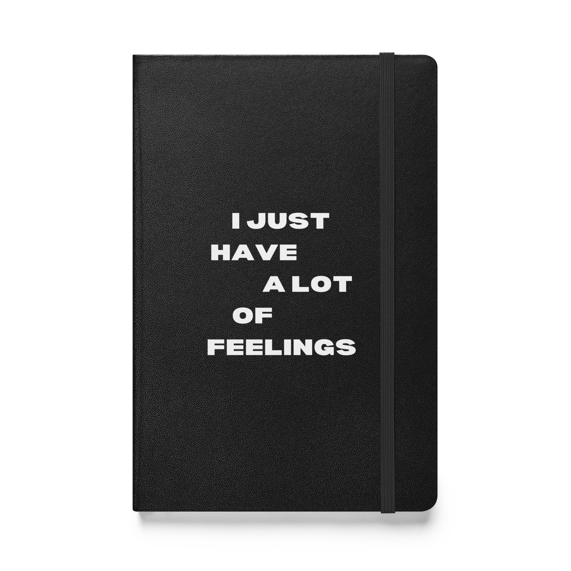 Black notebook with white text: 'I JUST HAVE A LOT OF FEELINGS' in white font.
