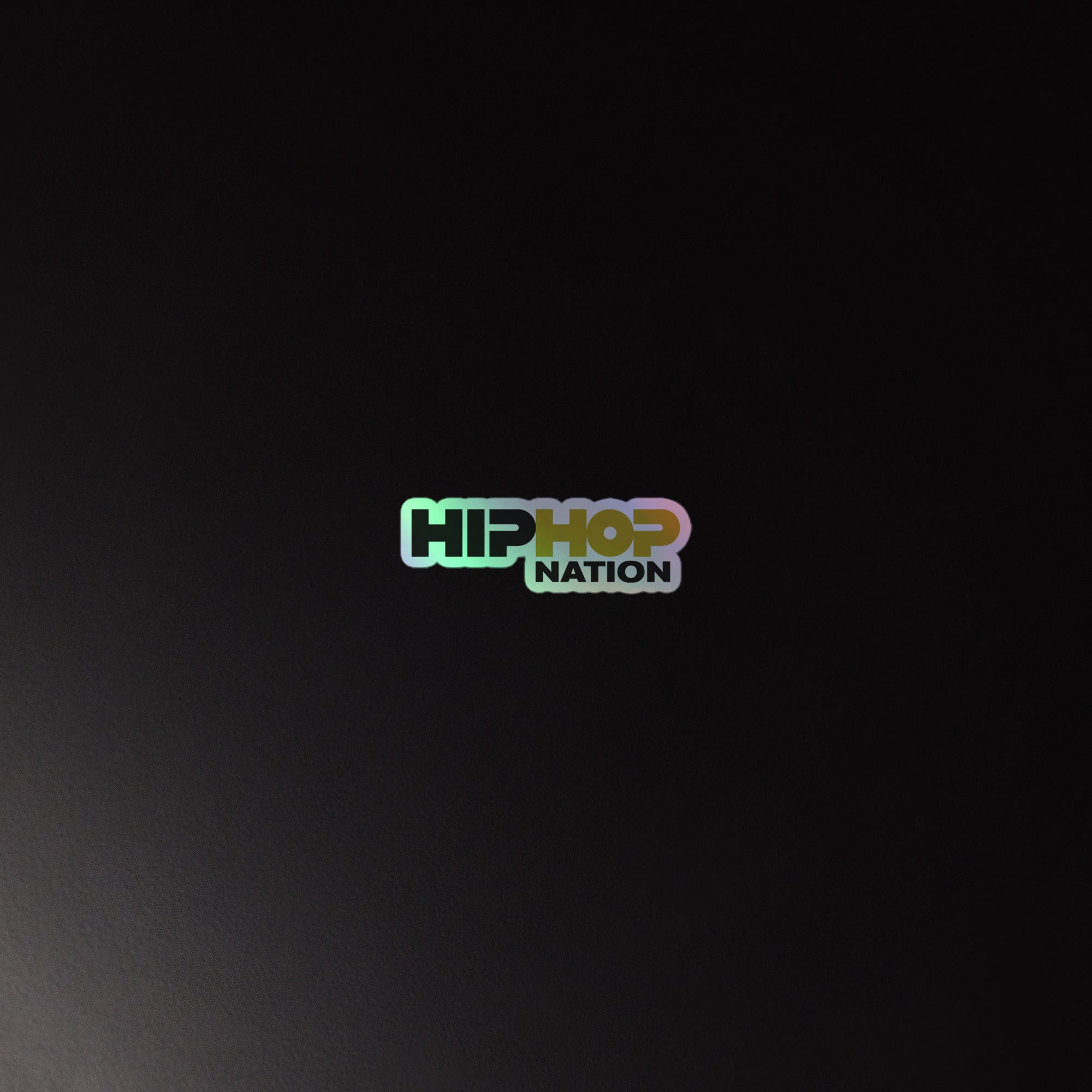 Holographic sticker of the 'HIP HOP NATION' logo on a dark background, featuring colorful, stylized text.