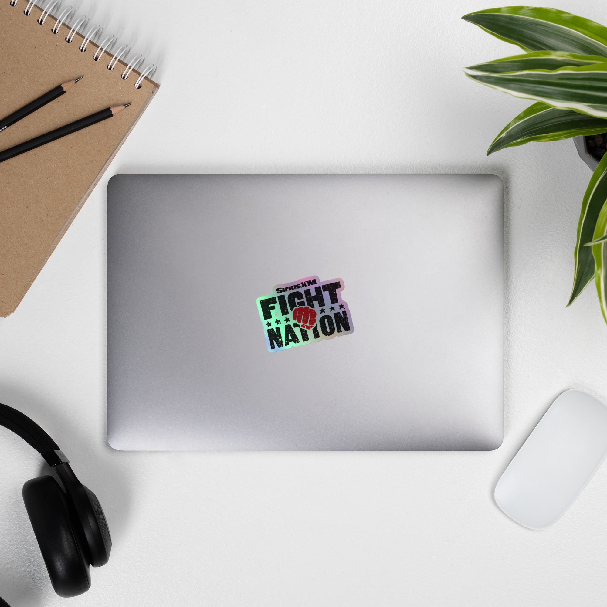 A laptop displaying a 'SiriusXM Fight Nation' holographic sticker