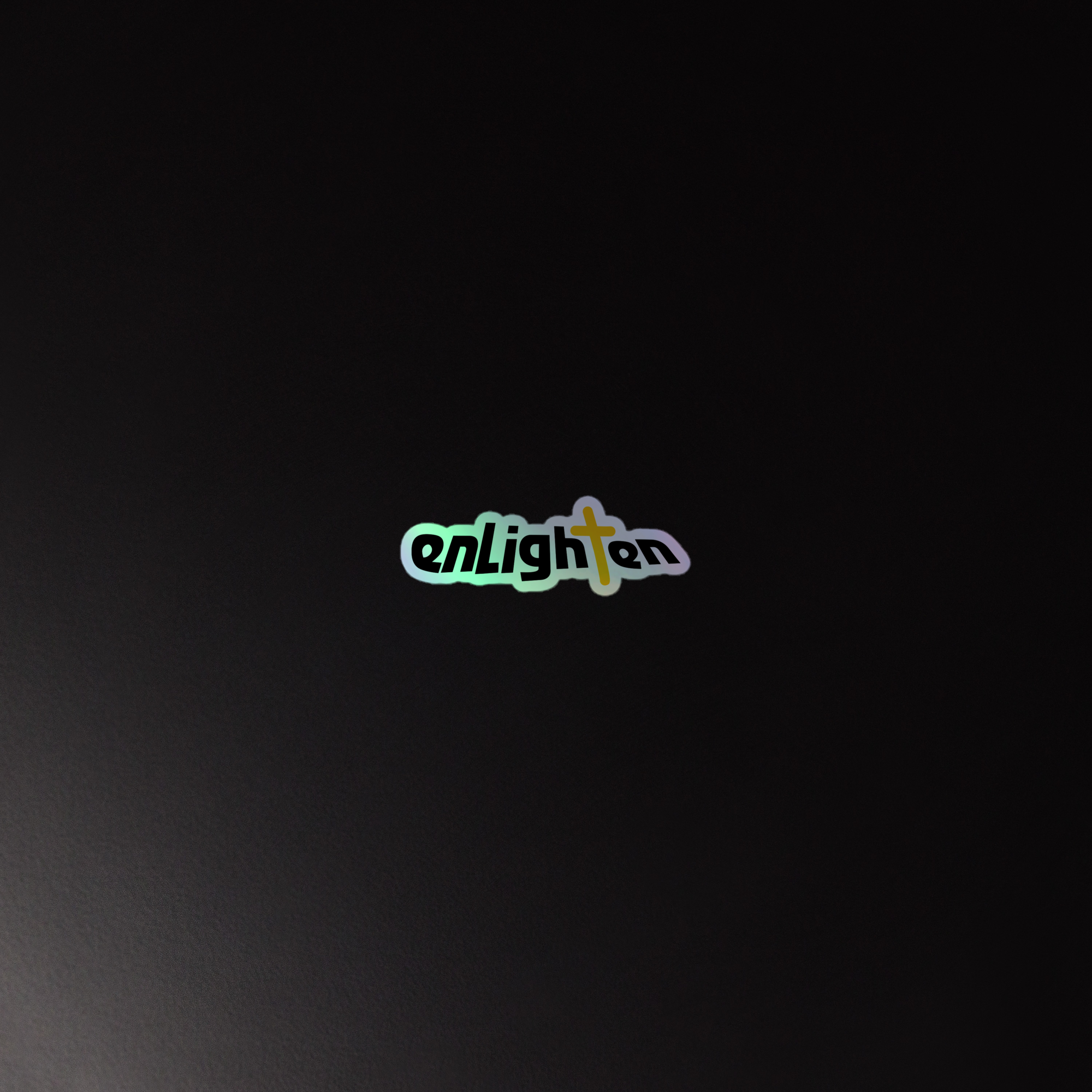 Holographic sticker of the colorful 'enlighten' logo on a dark background with a cross integrated into the text.