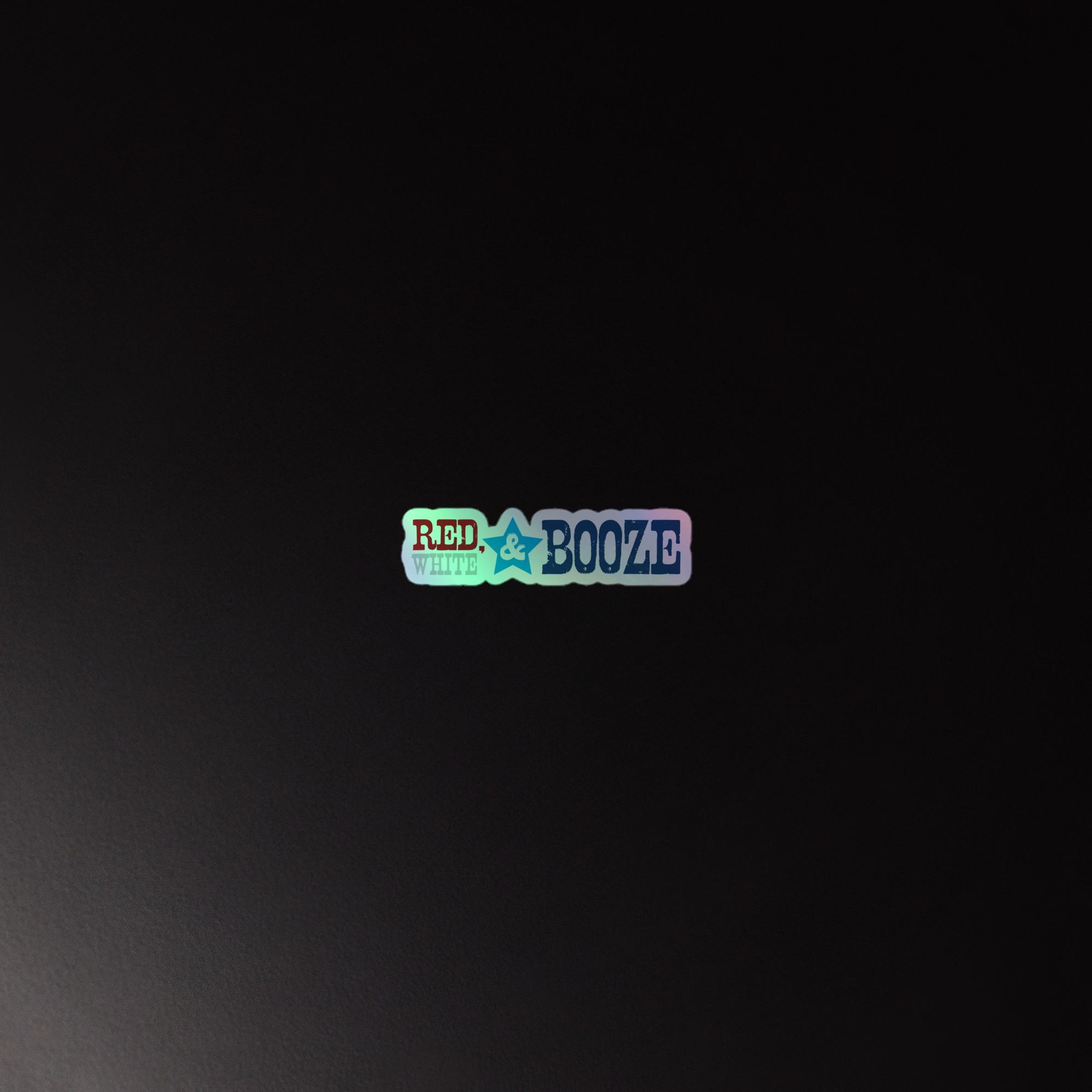 Holographic sticker of the 'RED, WHITE & BOOZE' logo on a dark background.