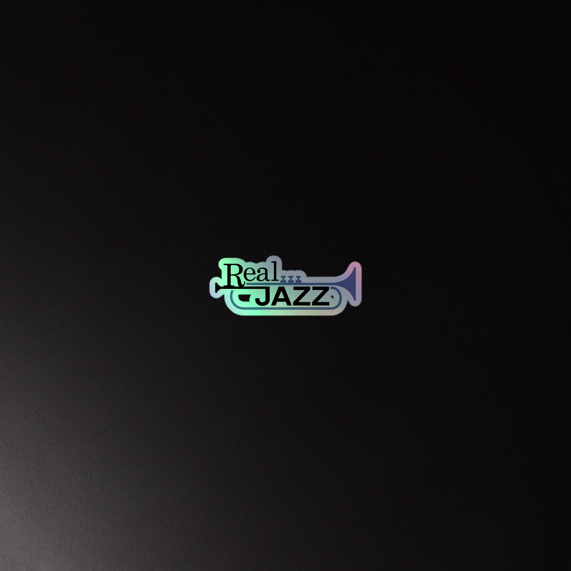 Holographic sticker of the 'Real Jazz' logo featuring a trumpet against a dark background.