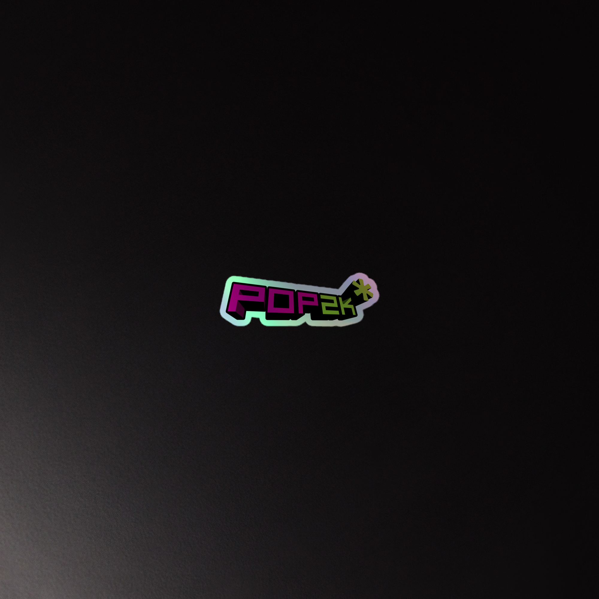 Holographic sticker of the colorful 'POP2K' logo on a dark background.