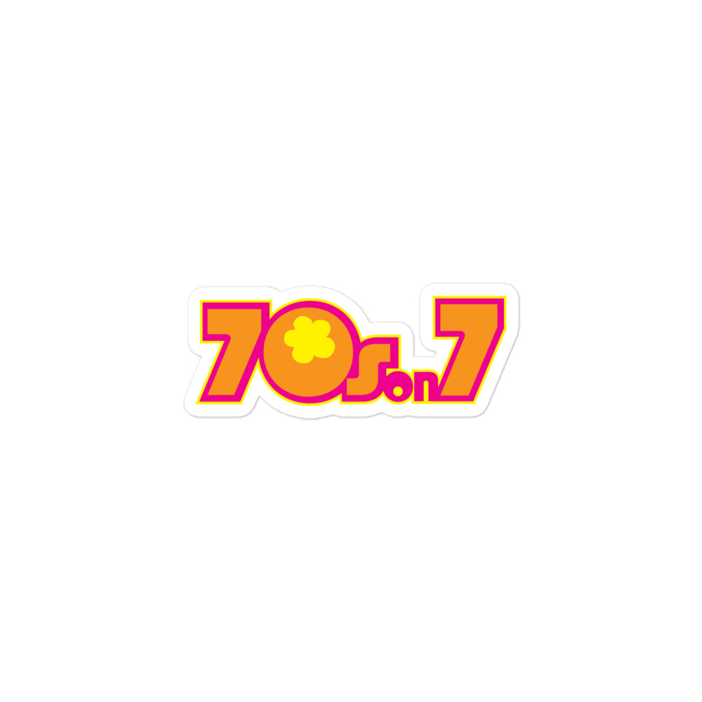 Sticker of the bright orange, hot pink and yellow '70s on 7' logo, featuring a flower design in the center of the '0'.