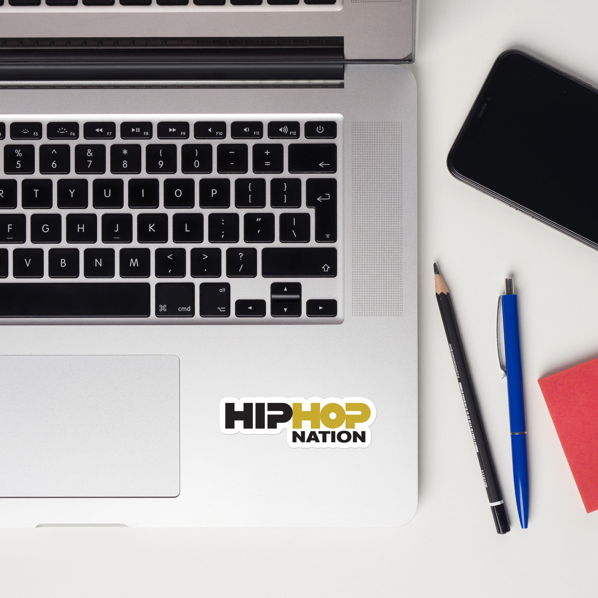 Laptop keyboard displaying a 'HIP HOP NATION' sticker.