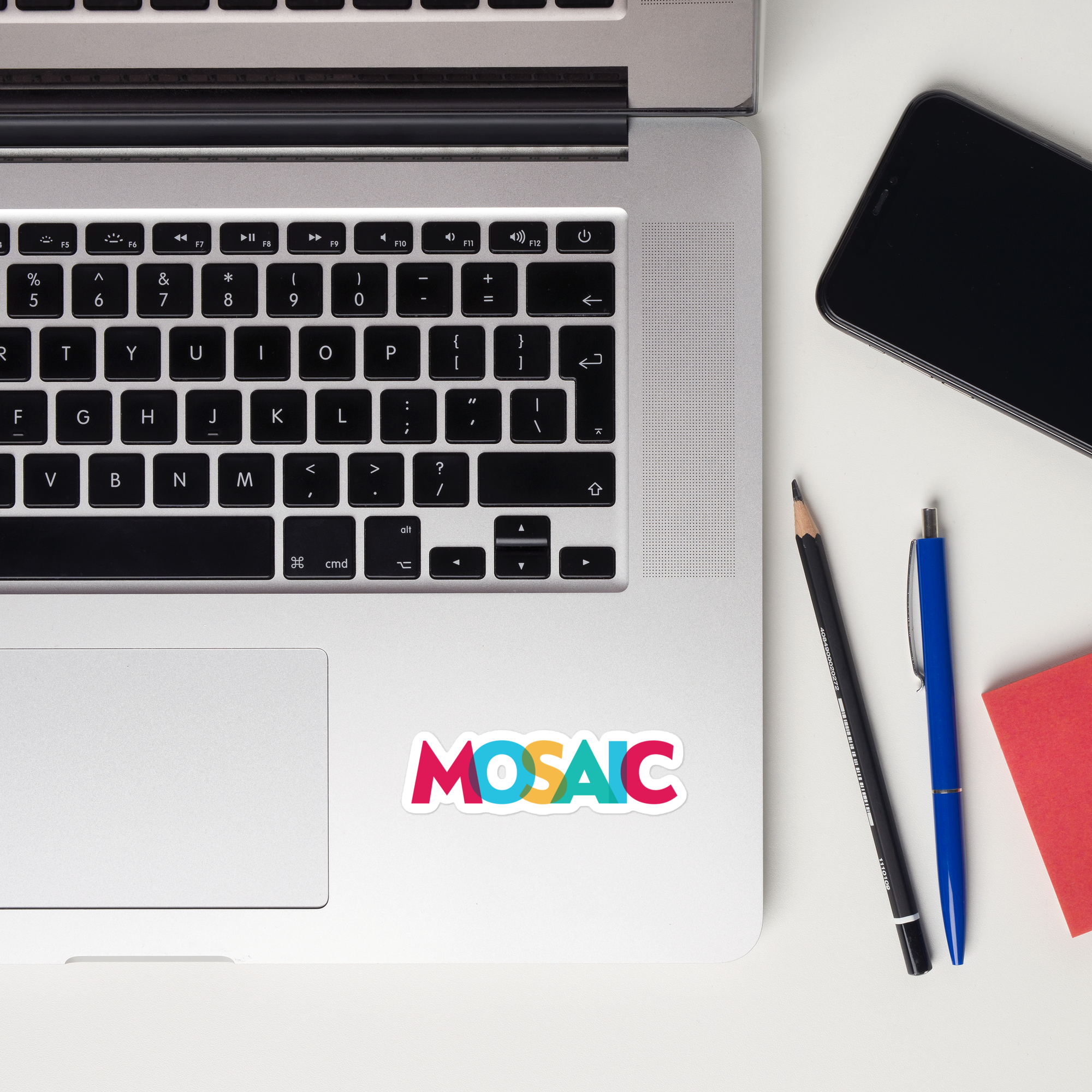 A laptop keyboard displaying a 'MOSAIC' sticker.