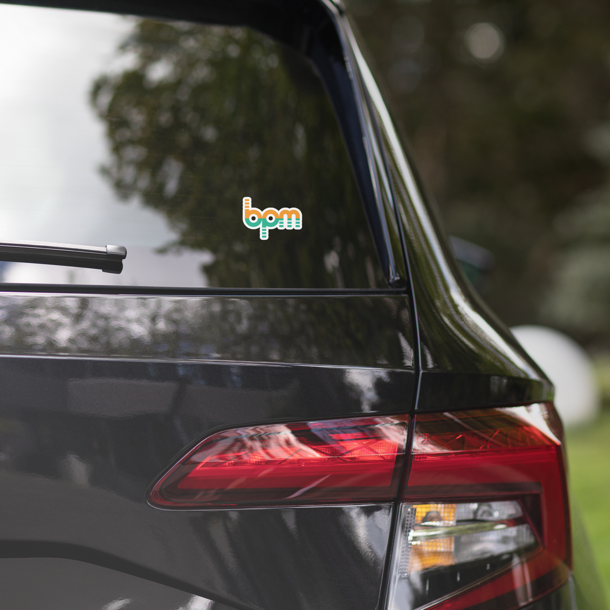 A black car's rear window features a 'BPM' sticker.