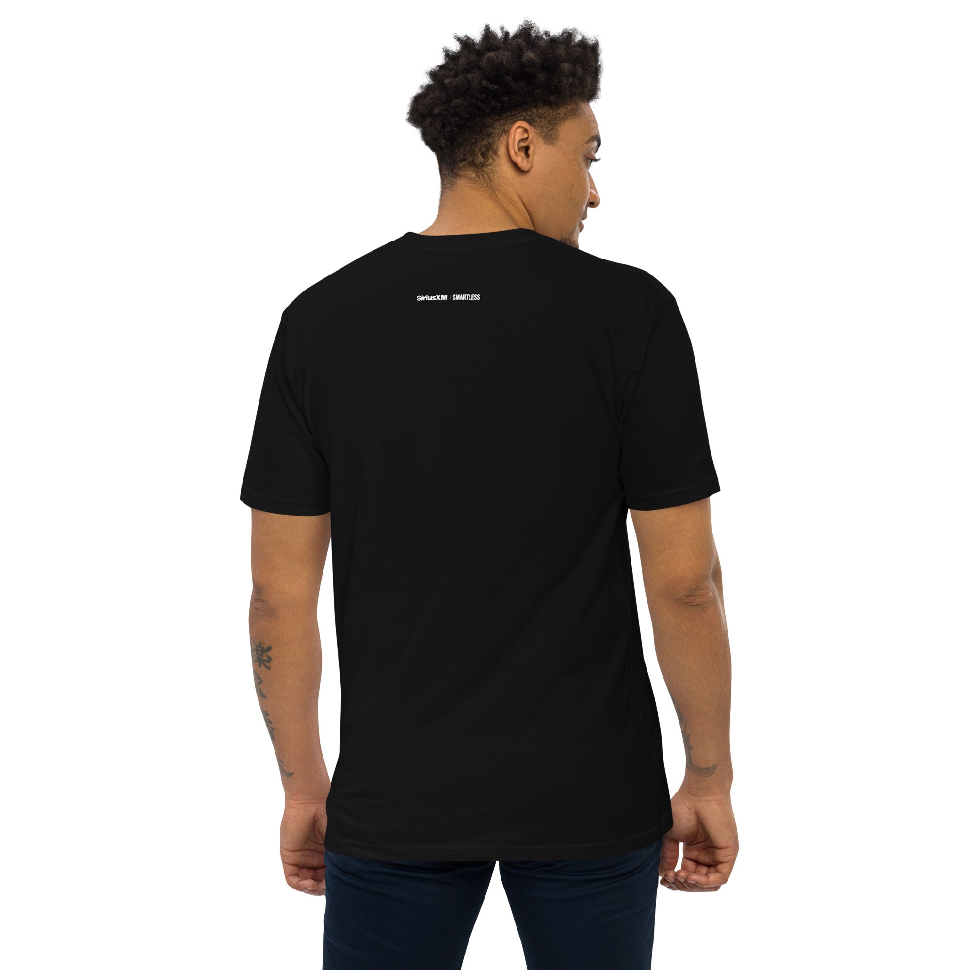 Man with short hair wearing a black T-shirt viewed from the back. Small white logos at the top near the neckline read 'SiriusXM' and 'SMARTLESS'.