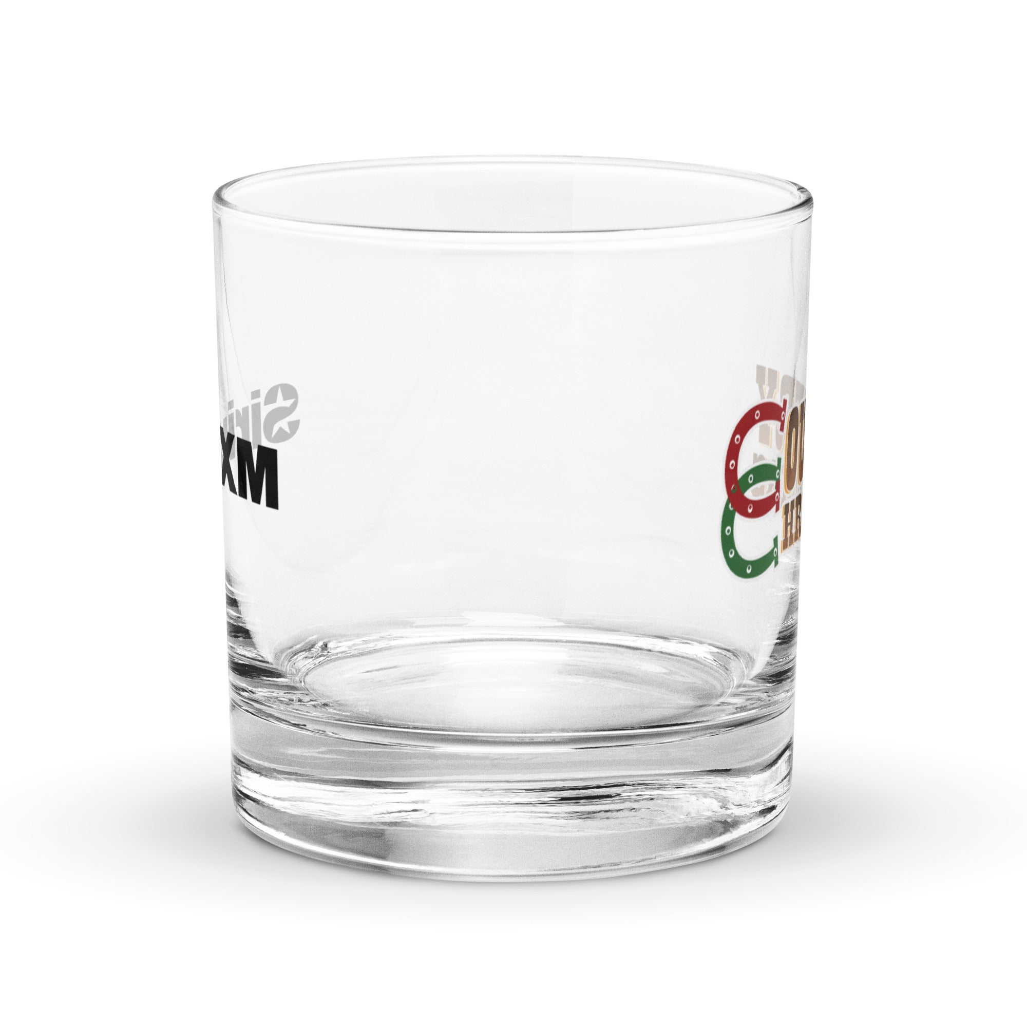 Close-up of an empty clear rocks glass showing partial ‘SiriusXM’ text on one side and a partial ‘Country Christmas’ logo on the other.