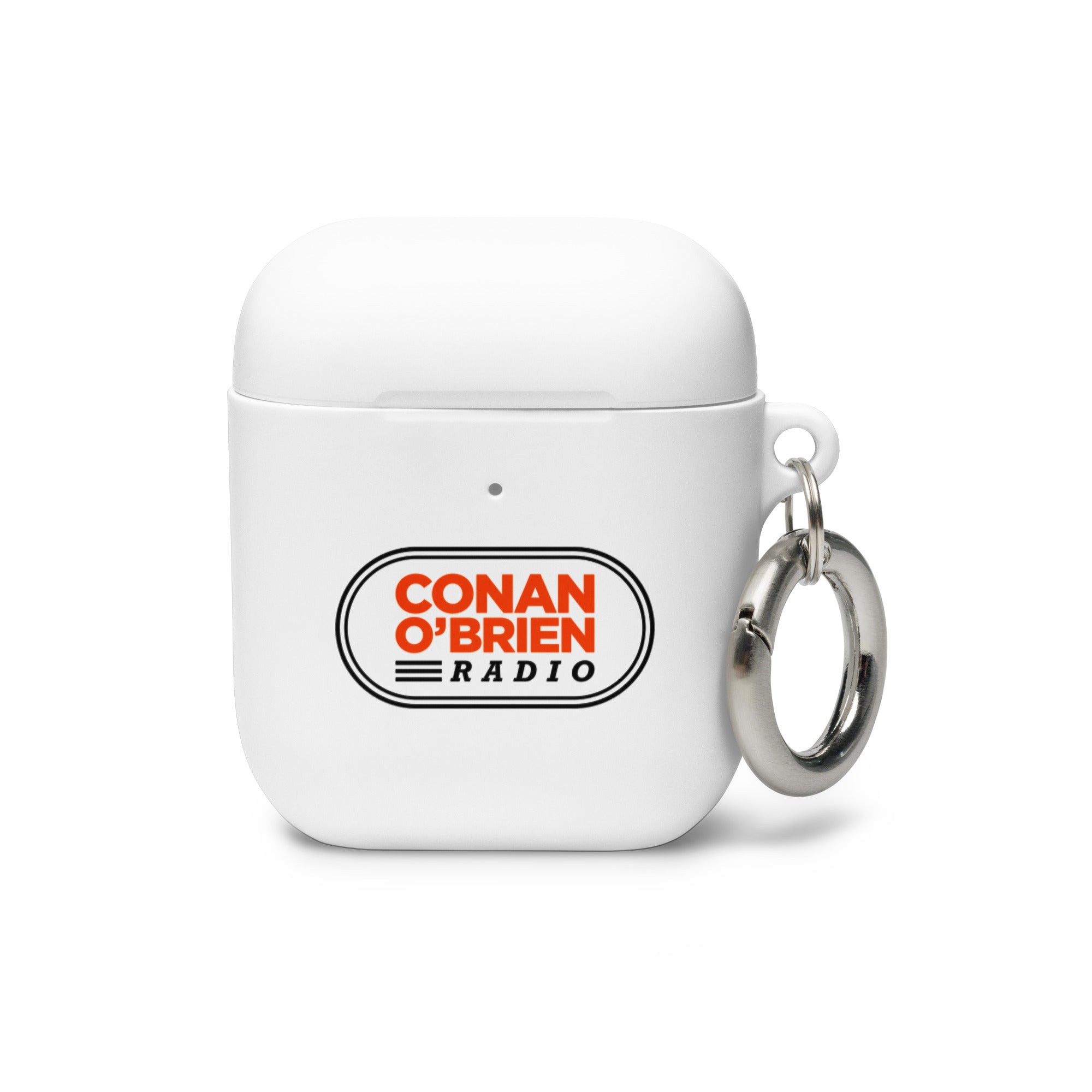 White AirPods case with 'CONAN O'BRIEN RADIO' logo in orange and black and a silver keyring attached.