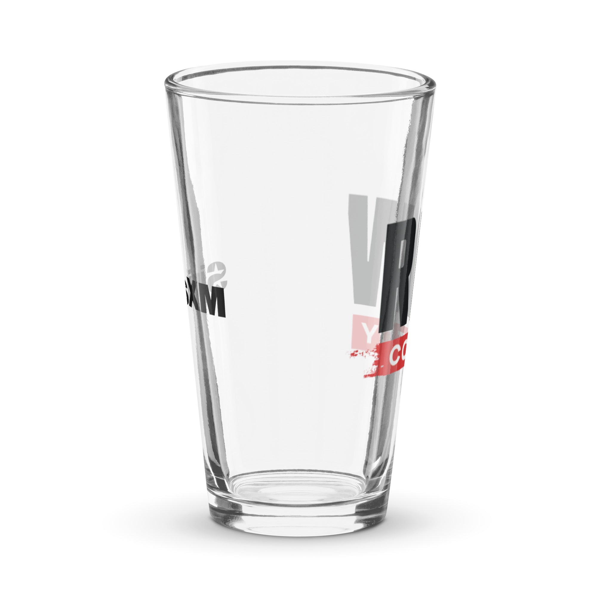 Side view of clear pint glass featuring partially visible front and back designs.