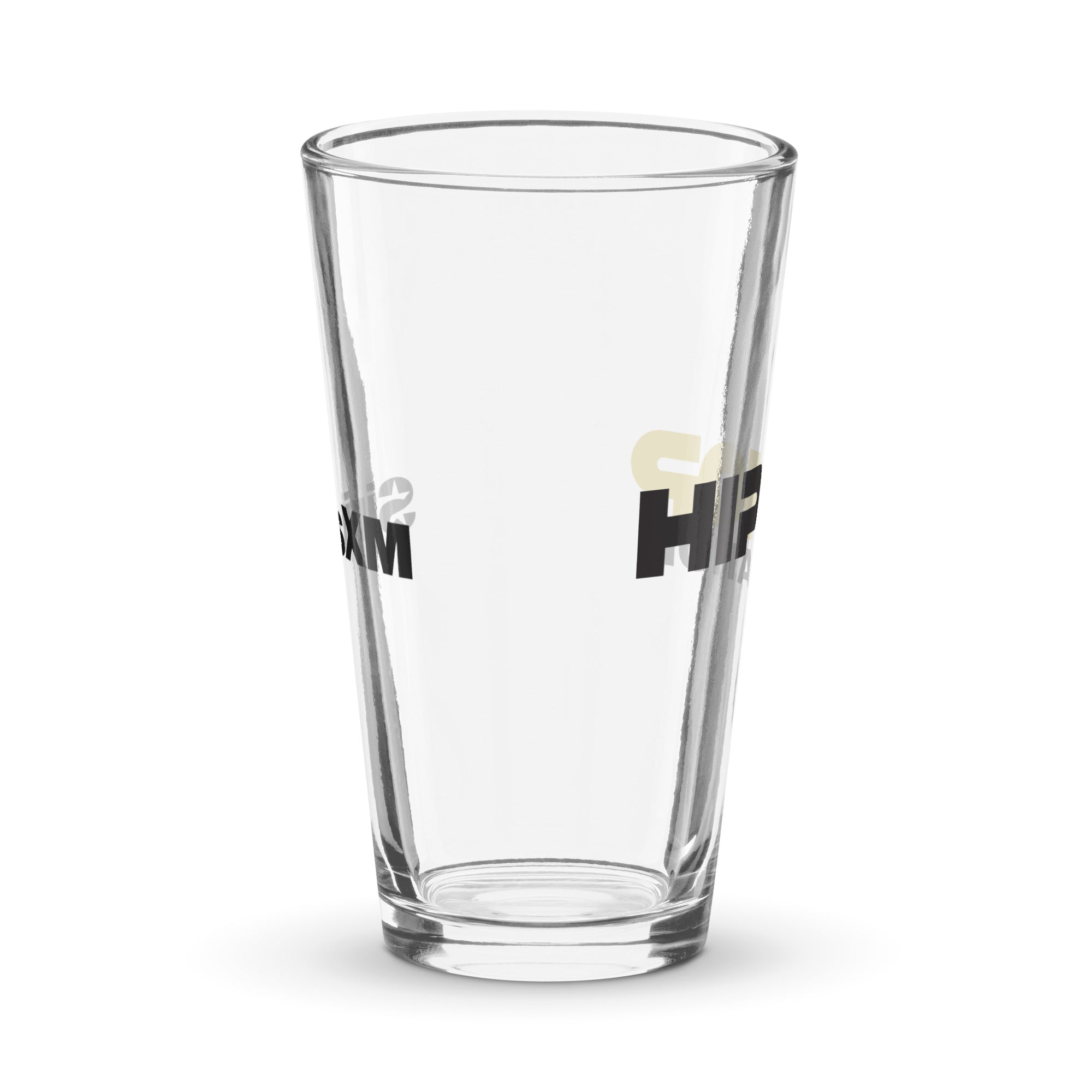 Side view of clear pint glass featuring partially visible front and back designs.