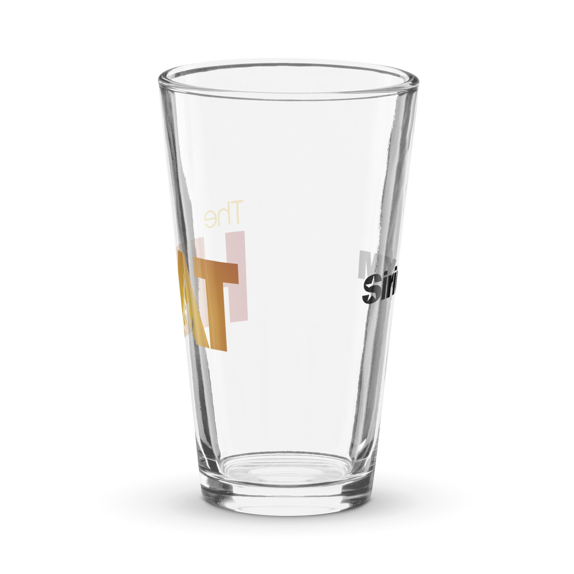 Side view of clear pint glass featuring partially visible front and back designs.