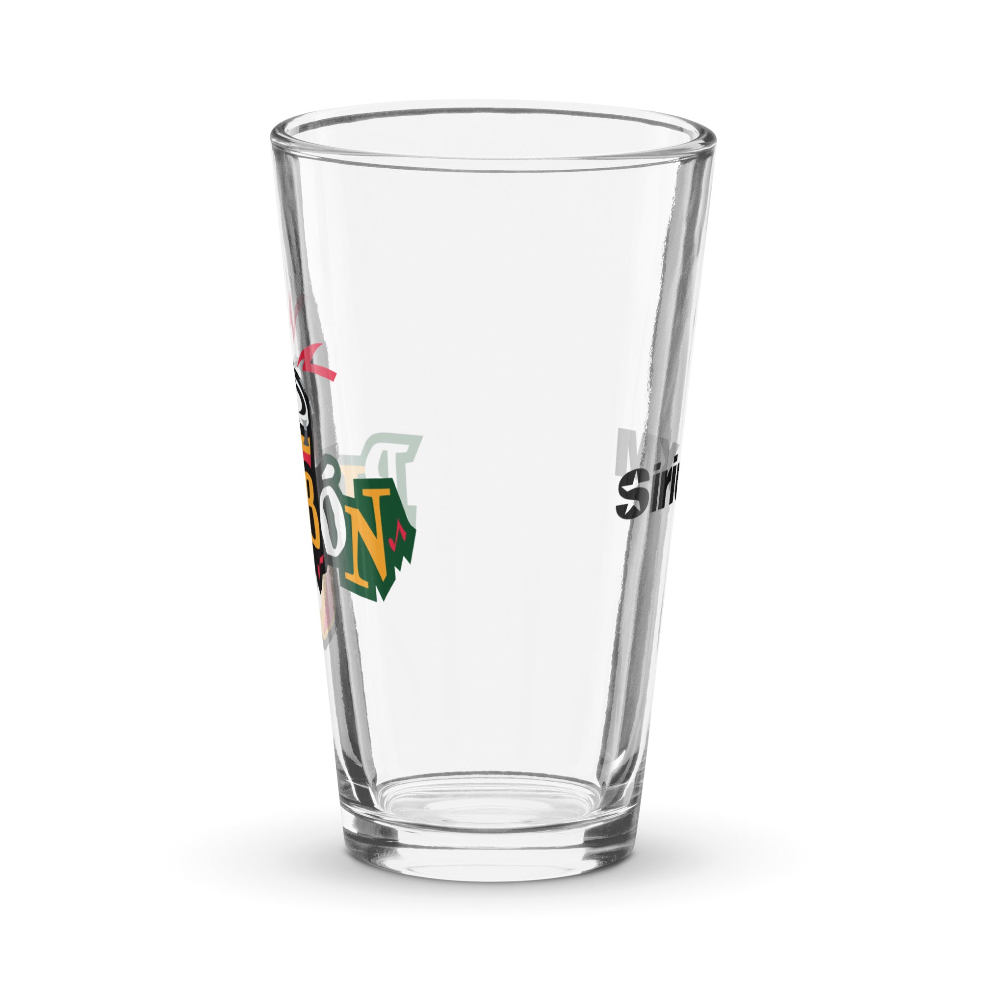 Side view of clear pint glass featuring partially visible front and back designs.