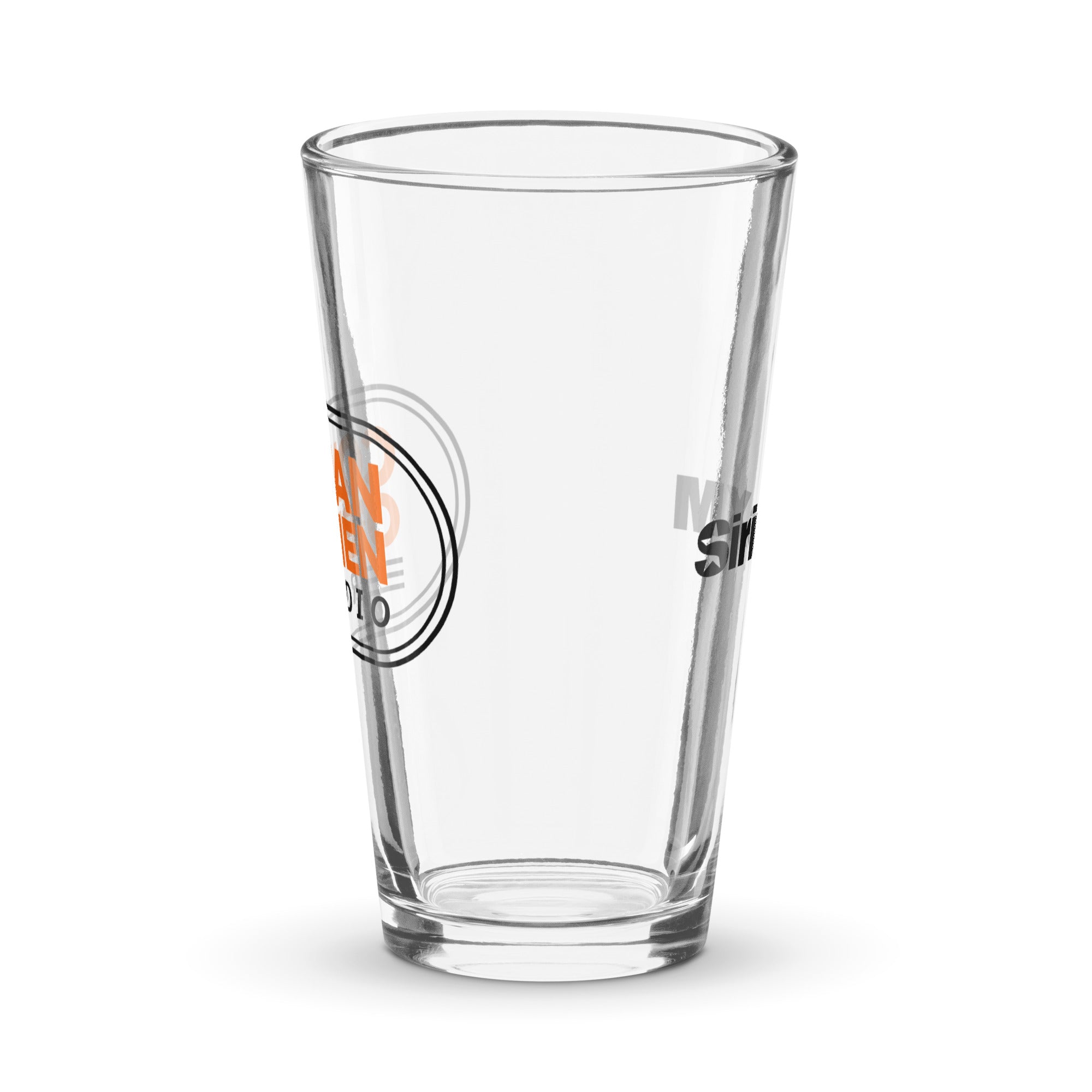 Side view of clear pint glass featuring partially visible front and back designs.