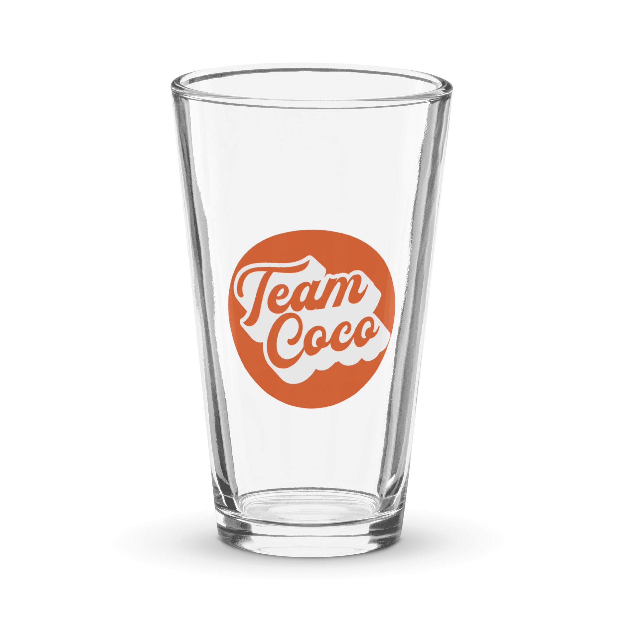 Clear glass pint glass featuring a circular 'Team Coco' logo in orange and white.