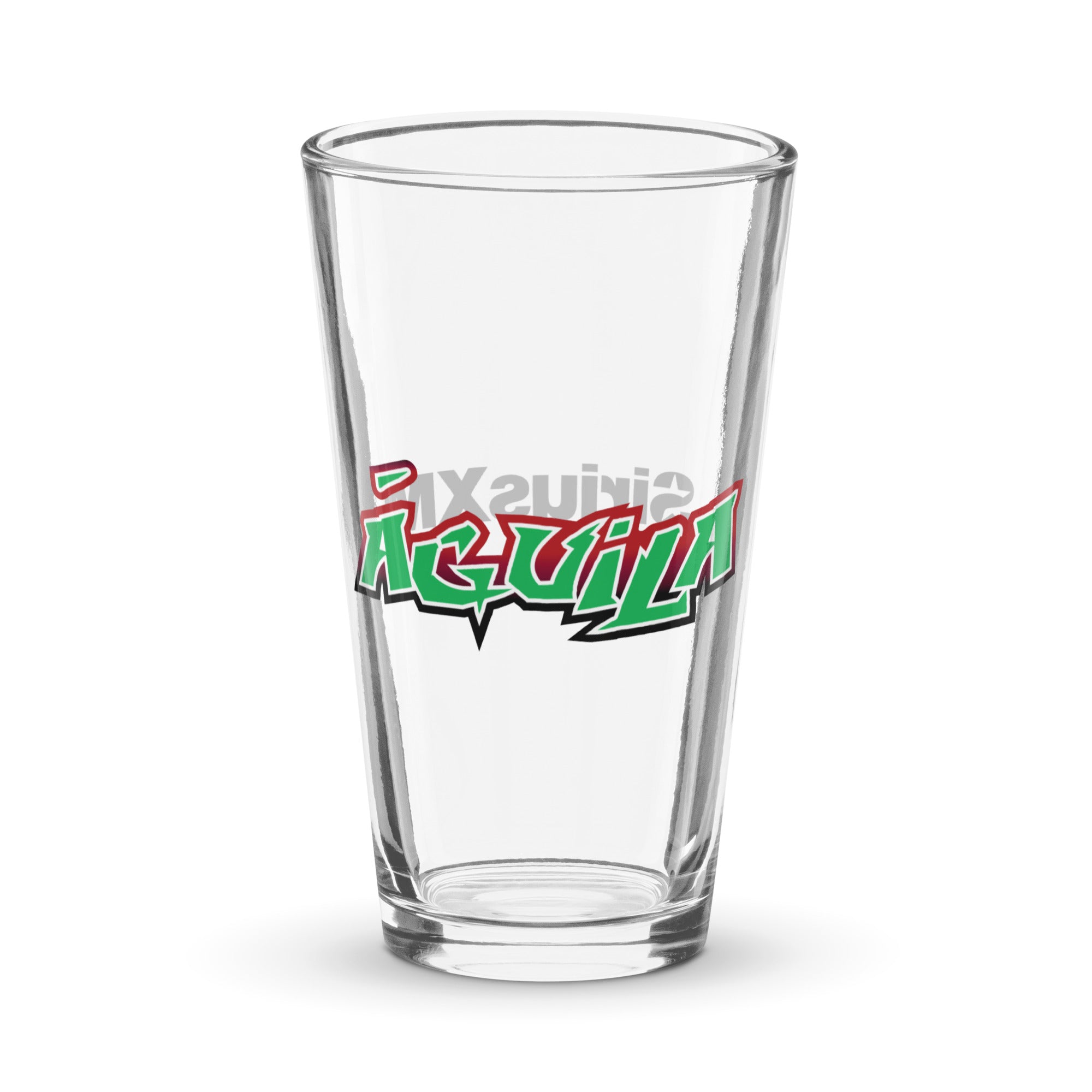 A pint glass featuring the word 'Águila' in bold red and green decorative font.