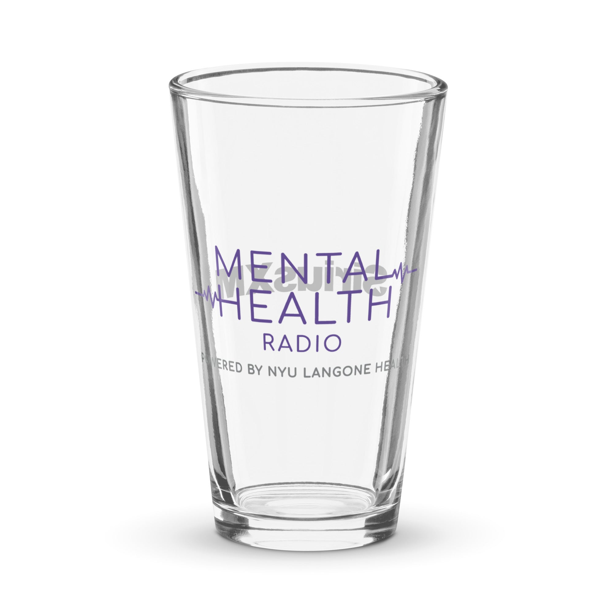 Clear pint glass tumbler with 'MENTAL HEALTH RADIO' and 'Powered by NYU Langone Health' printed purple text on it.