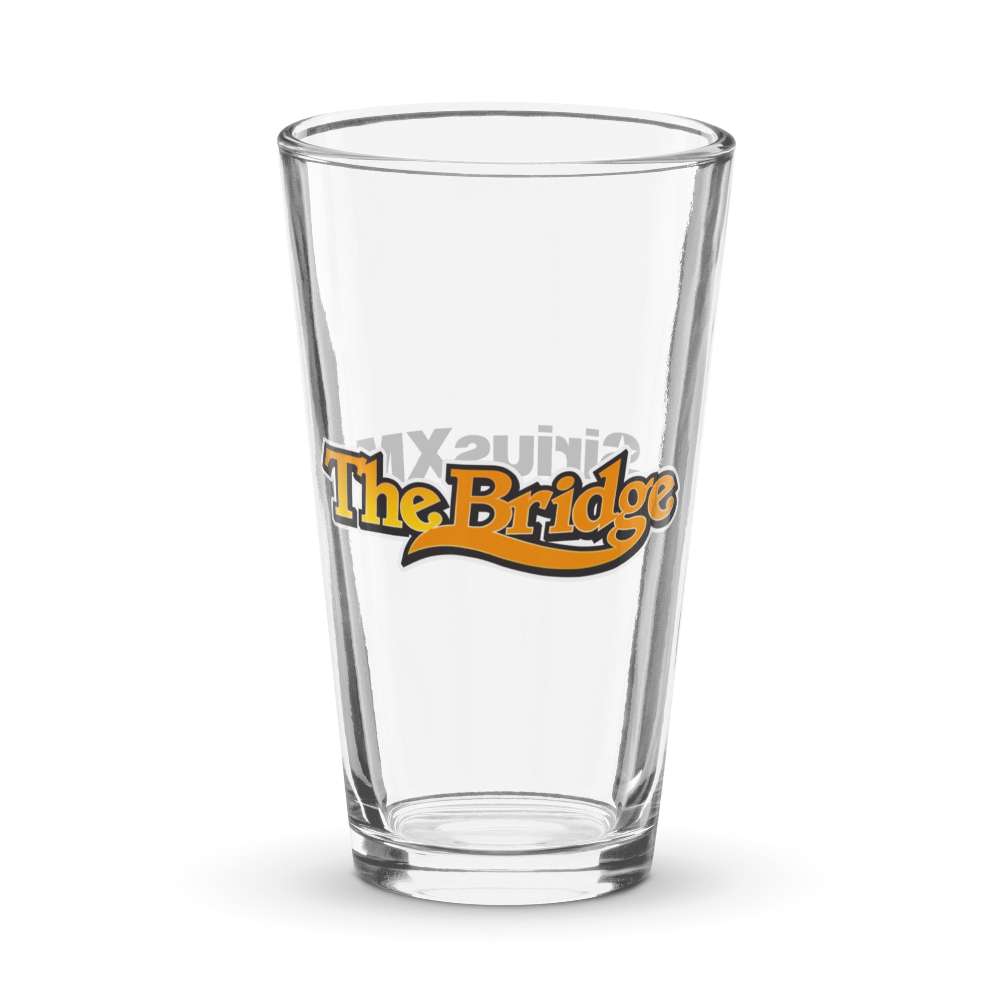 Clear glass pint with 'The Bridge' logo in orange and black.