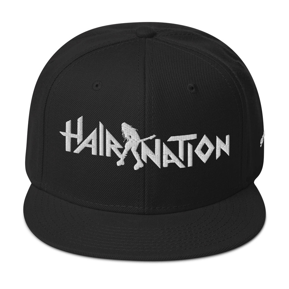 Black snapback cap featuring 'HAIR NATION' embroidered logo with a silhouette of a guitarist.